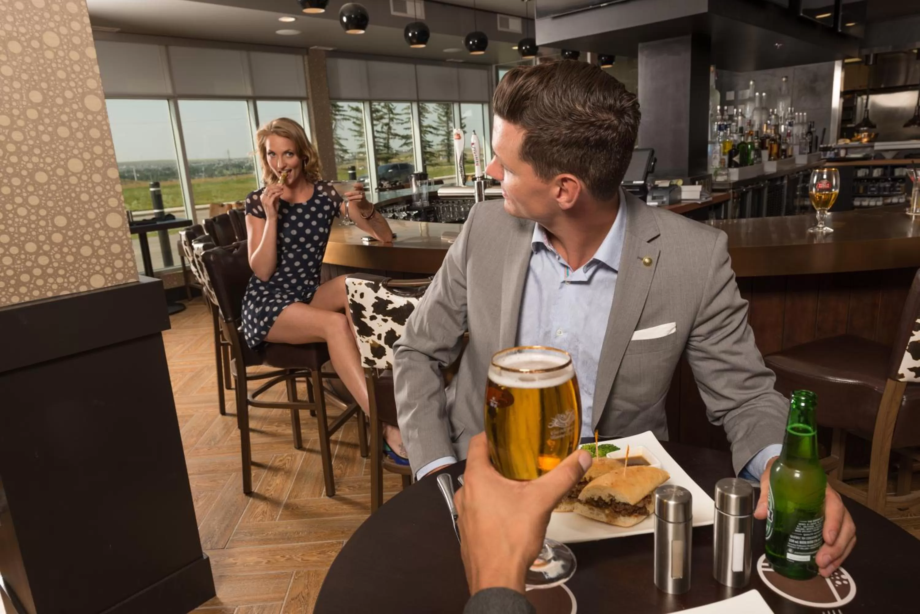 People in Applause Hotel Calgary Airport by CLIQUE