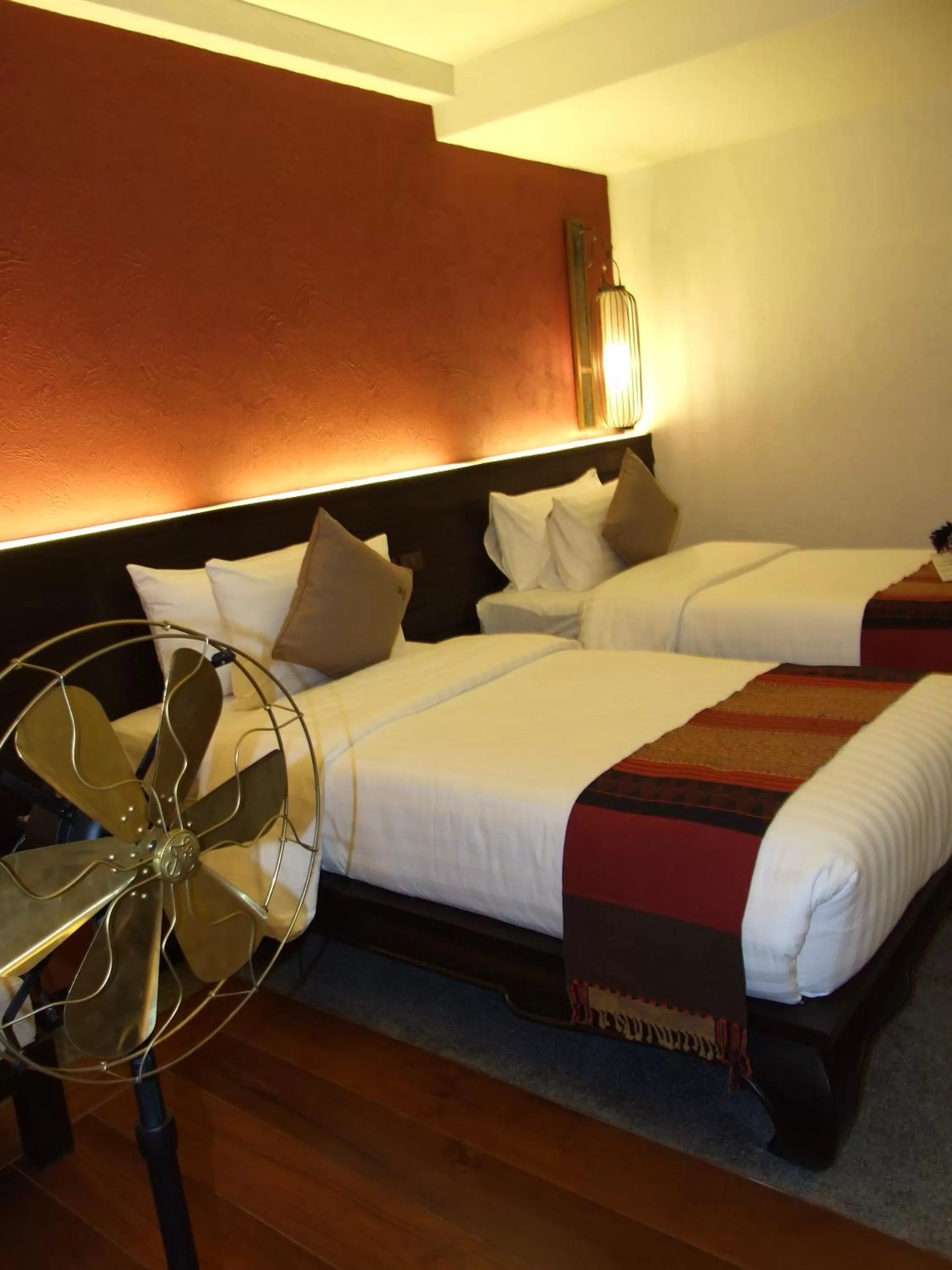 Bed in De Lanna Hotel