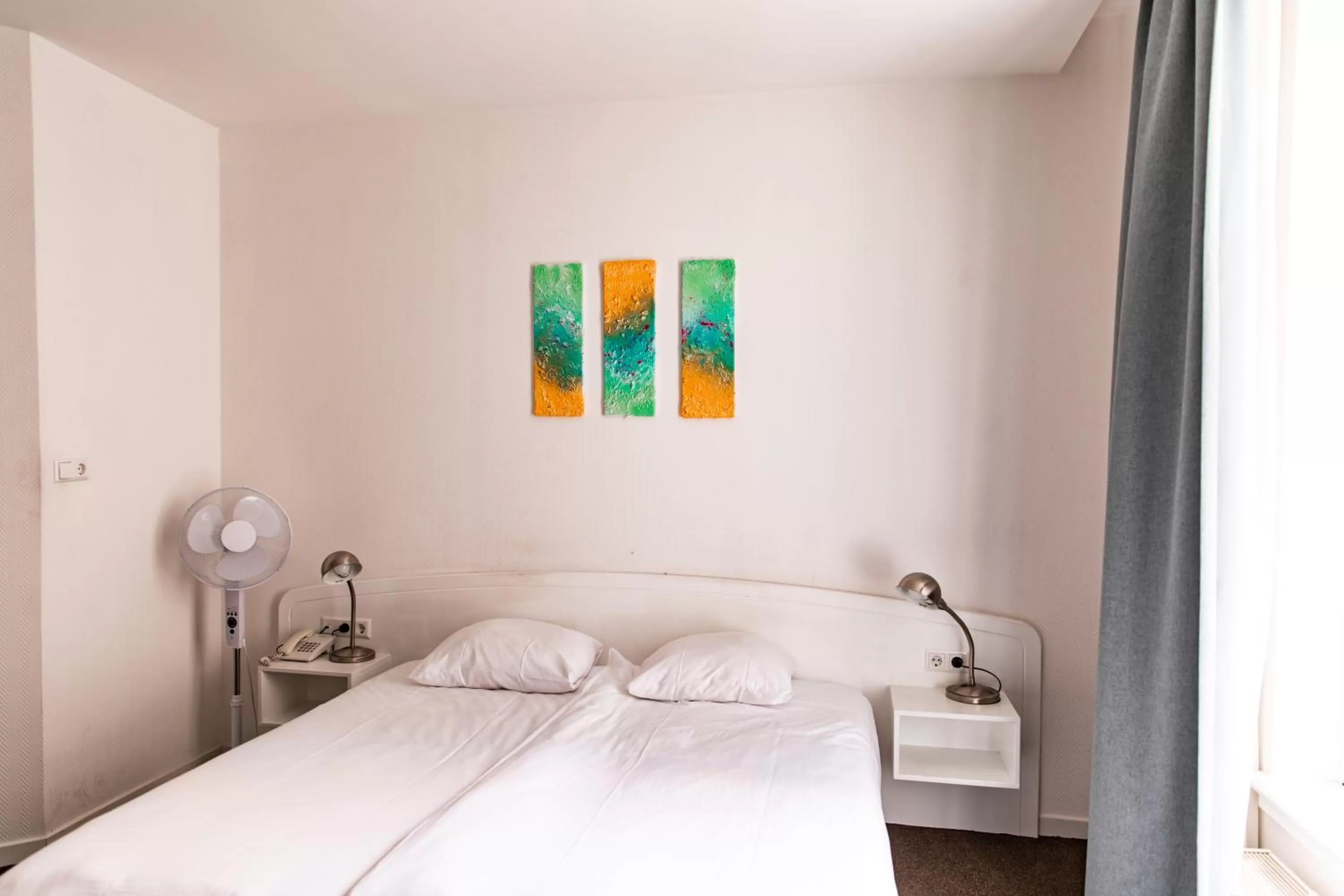 Bed in Ambassador City Centre Hotel