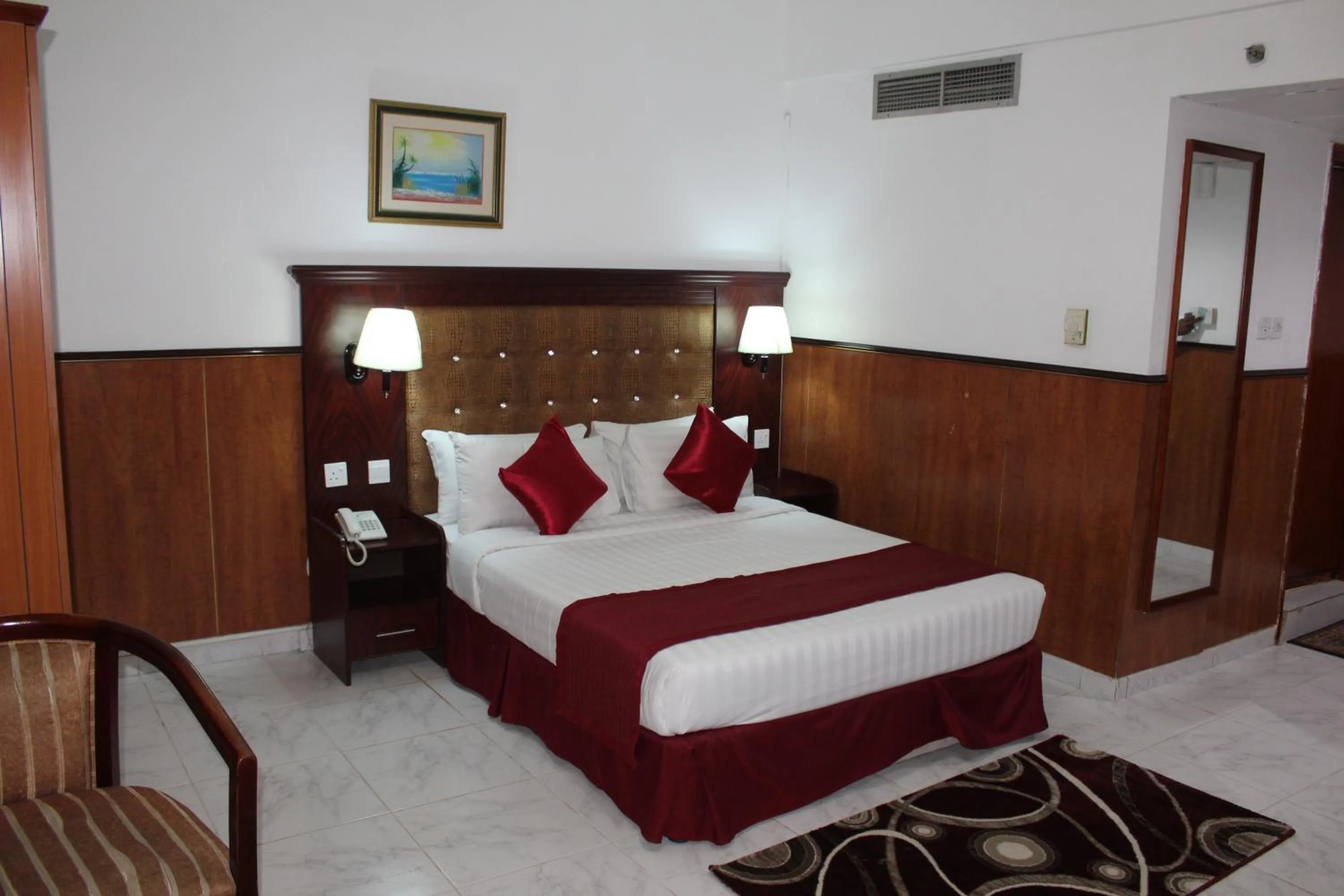 Bed in Grand Nova Hotel