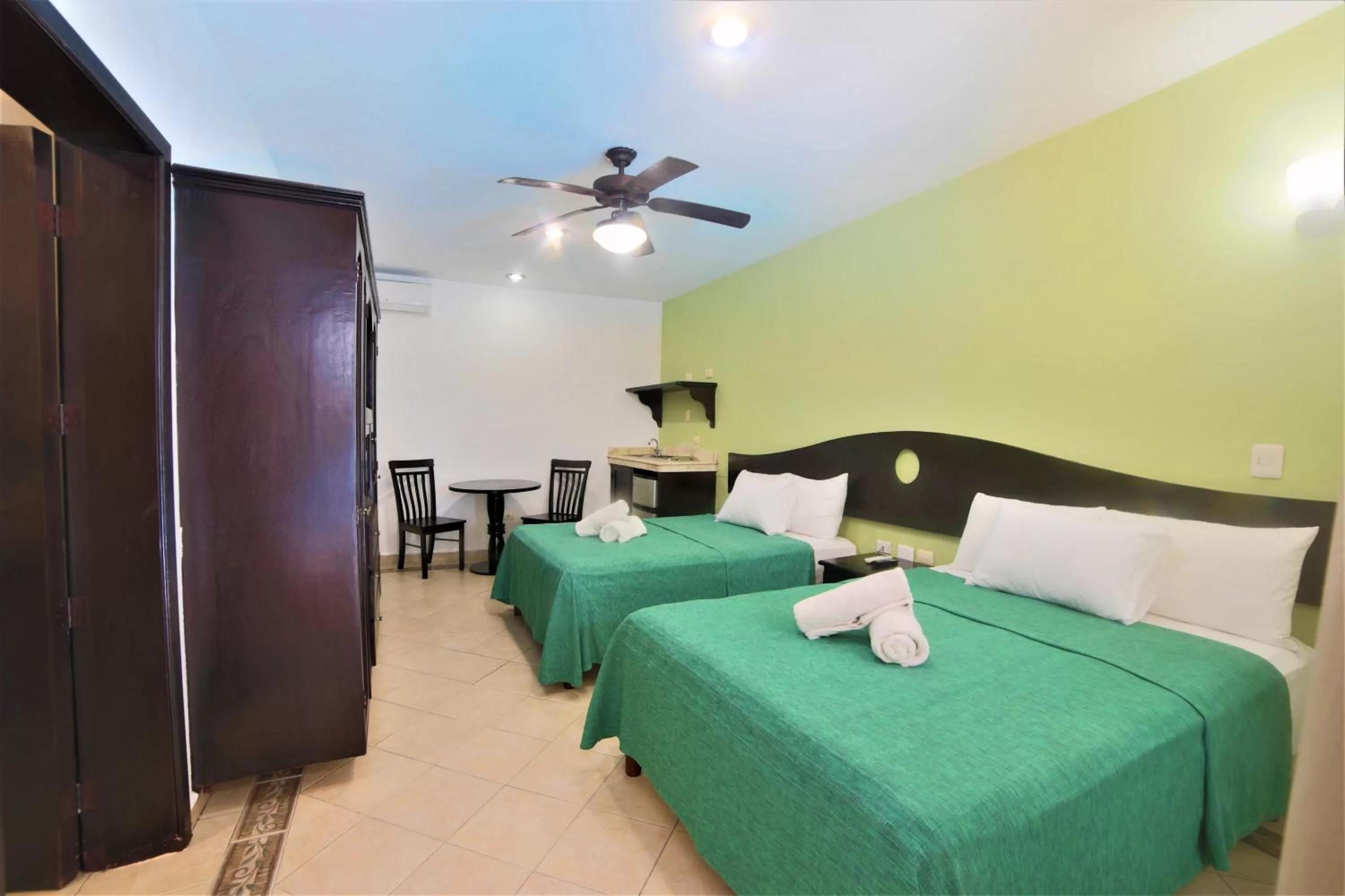 Photo of the whole room, Bed in Hotel Colonial Playa del Carmen