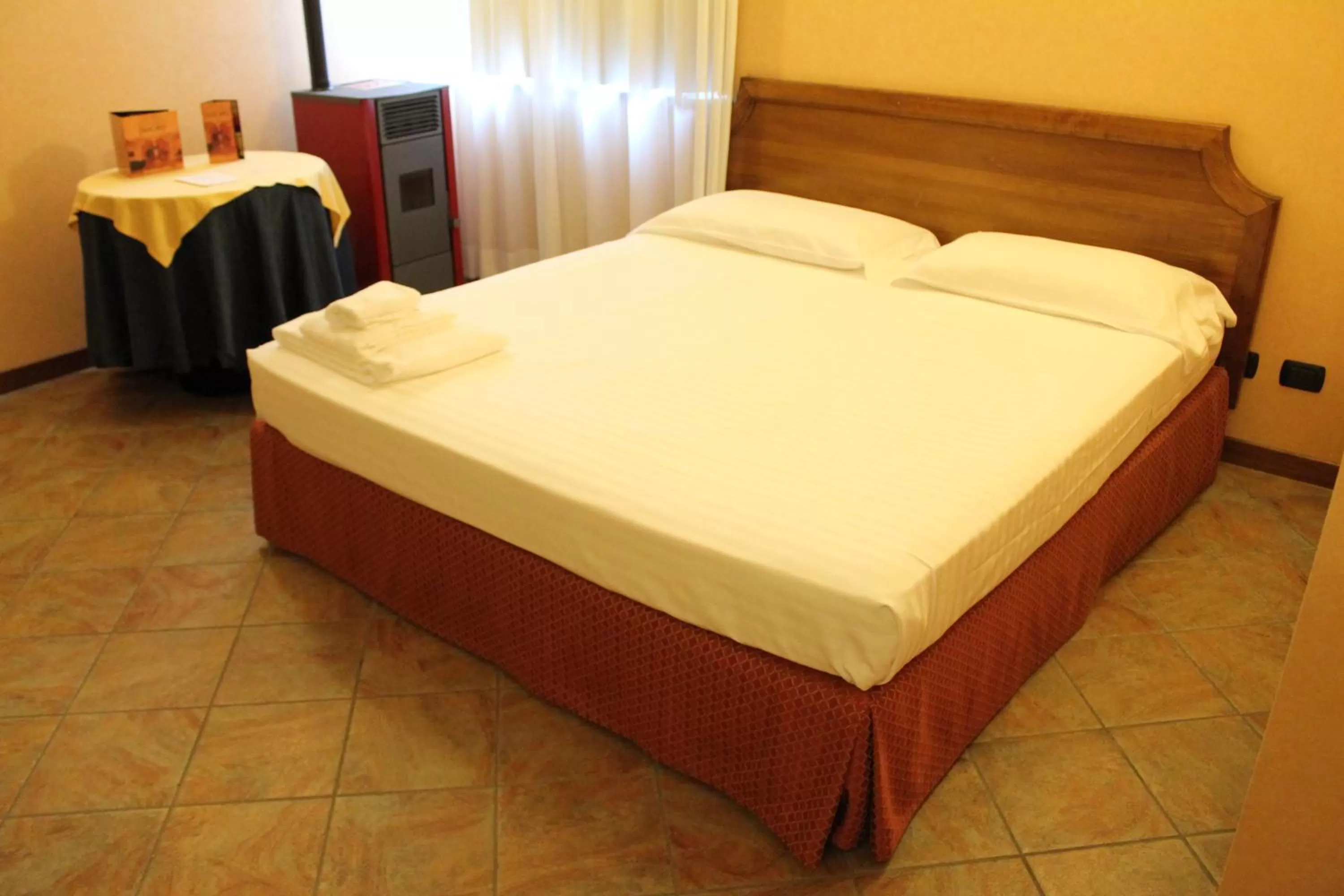 Bed in Hotel Don Carlo