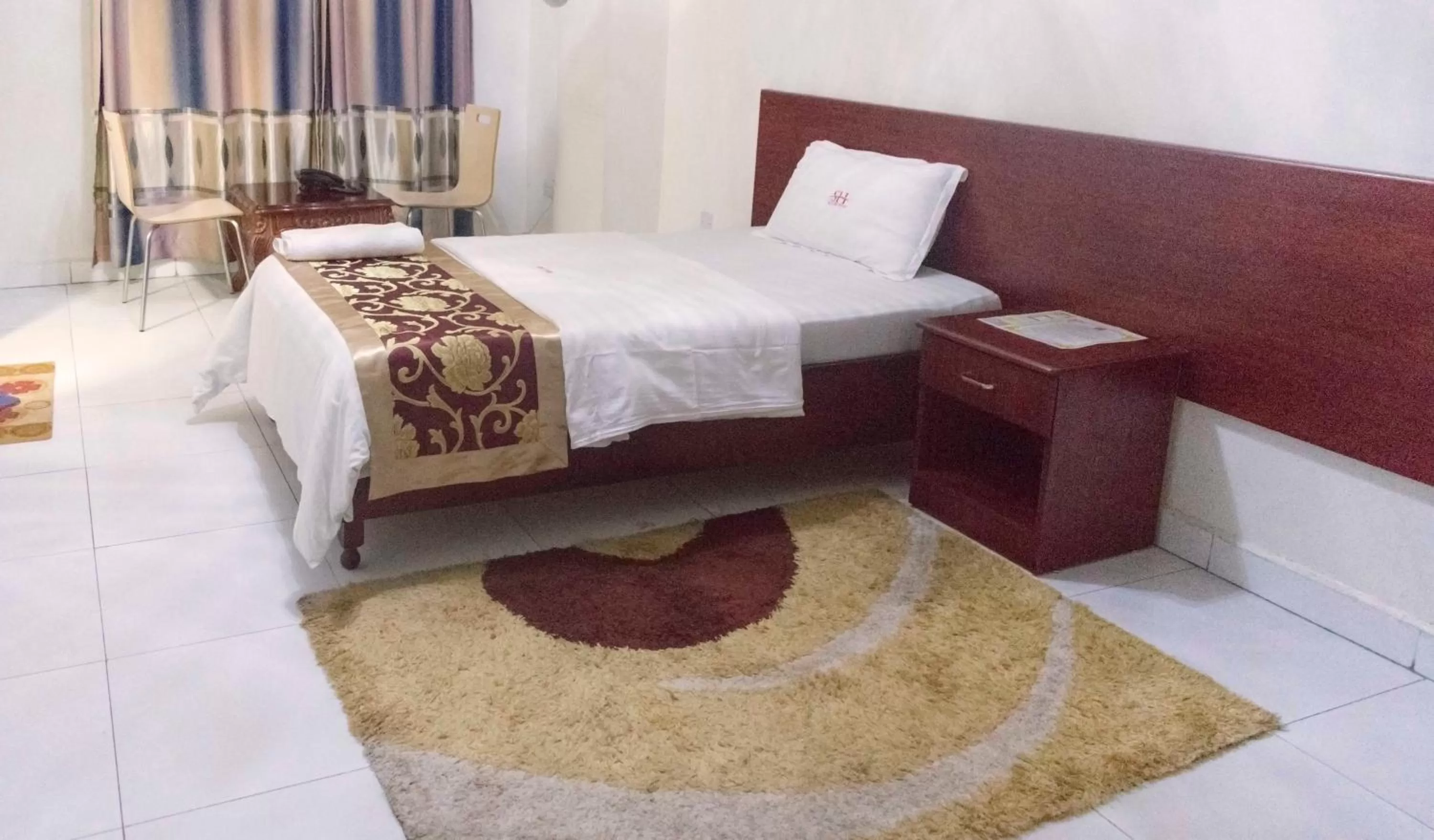 Bed in Sunrise Hotel Kampala