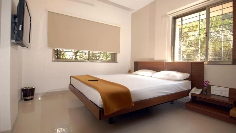 Bed in Sai Palace Budget Hotel