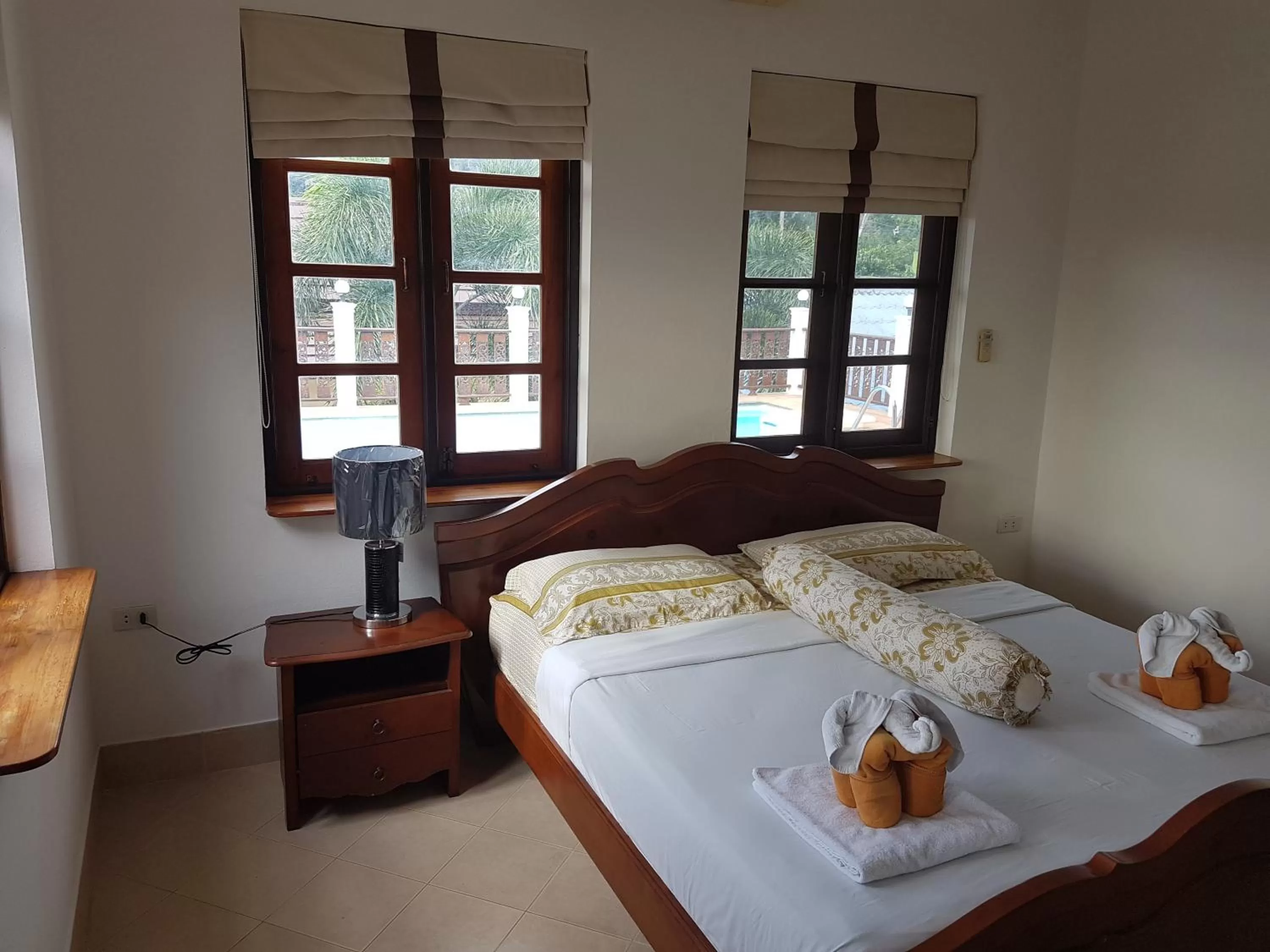 Bed in Jungle Village Bungalow