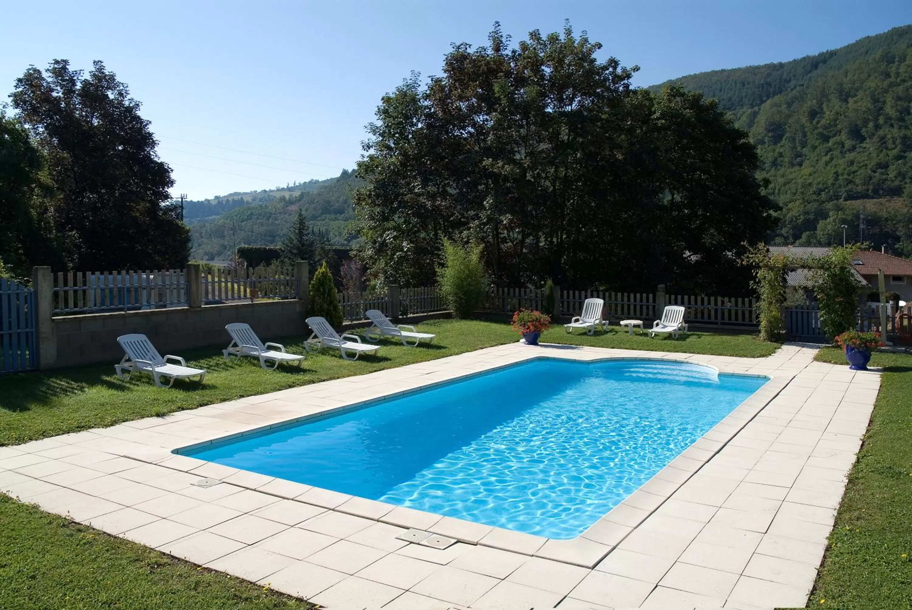 Swimming pool in Logis Hôtel Burnichon