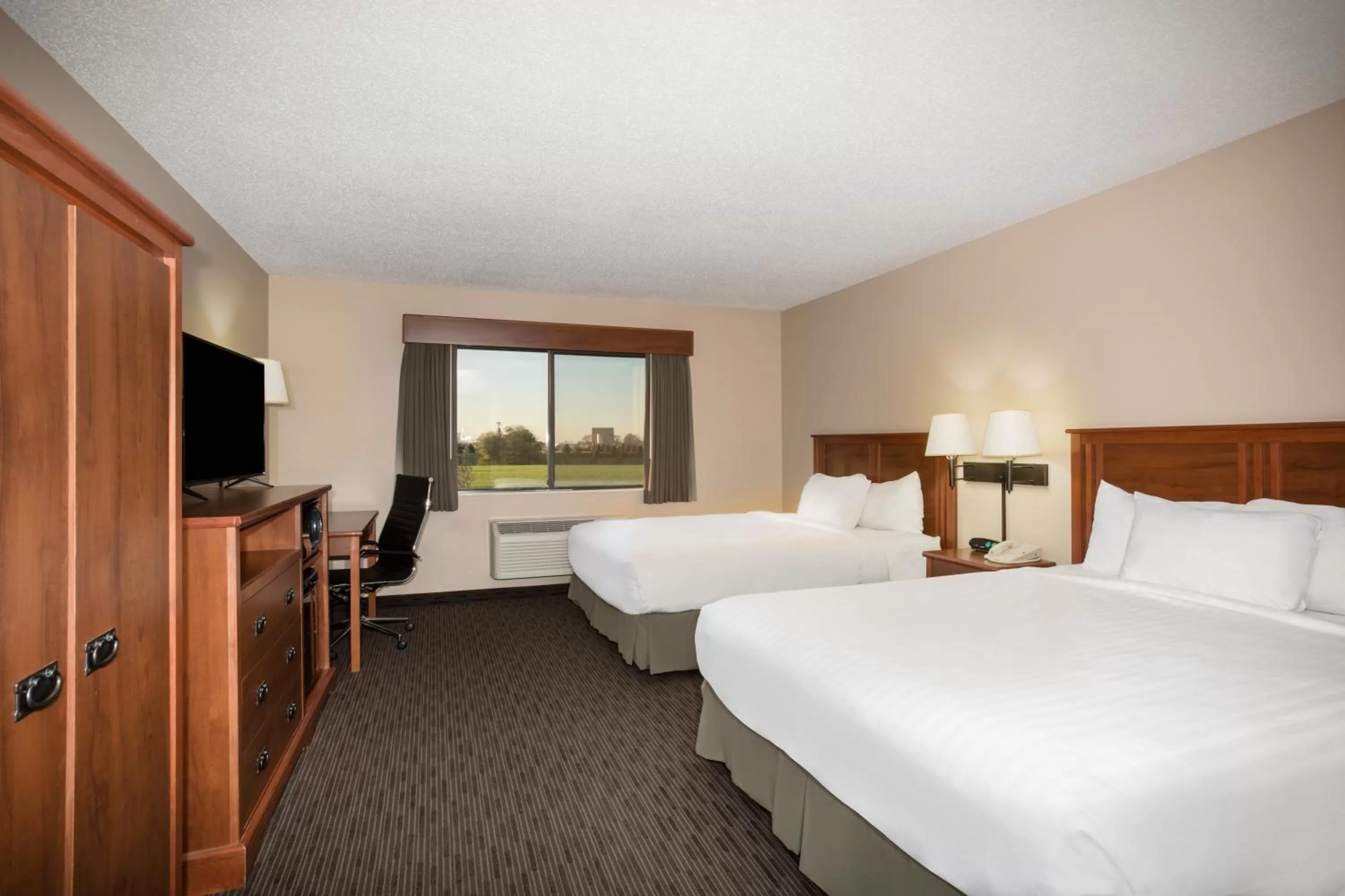 Bed in AmericInn by Wyndham Sioux City