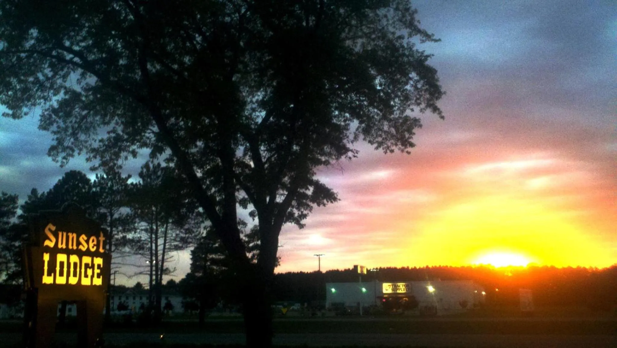 Property logo or sign in Sunset Lodge Escanaba