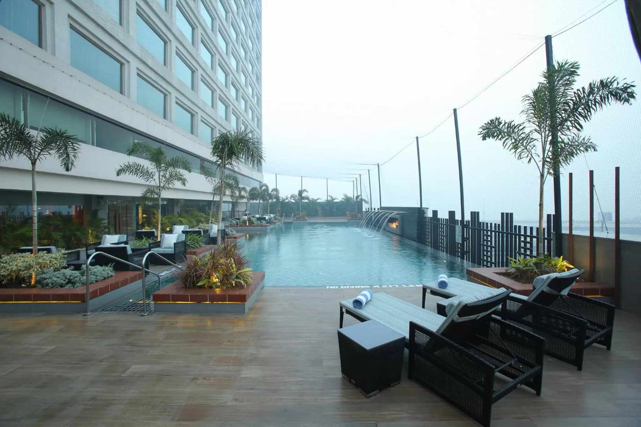 Swimming pool in Crowne Plaza New Delhi Mayur Vihar Noida by IHG