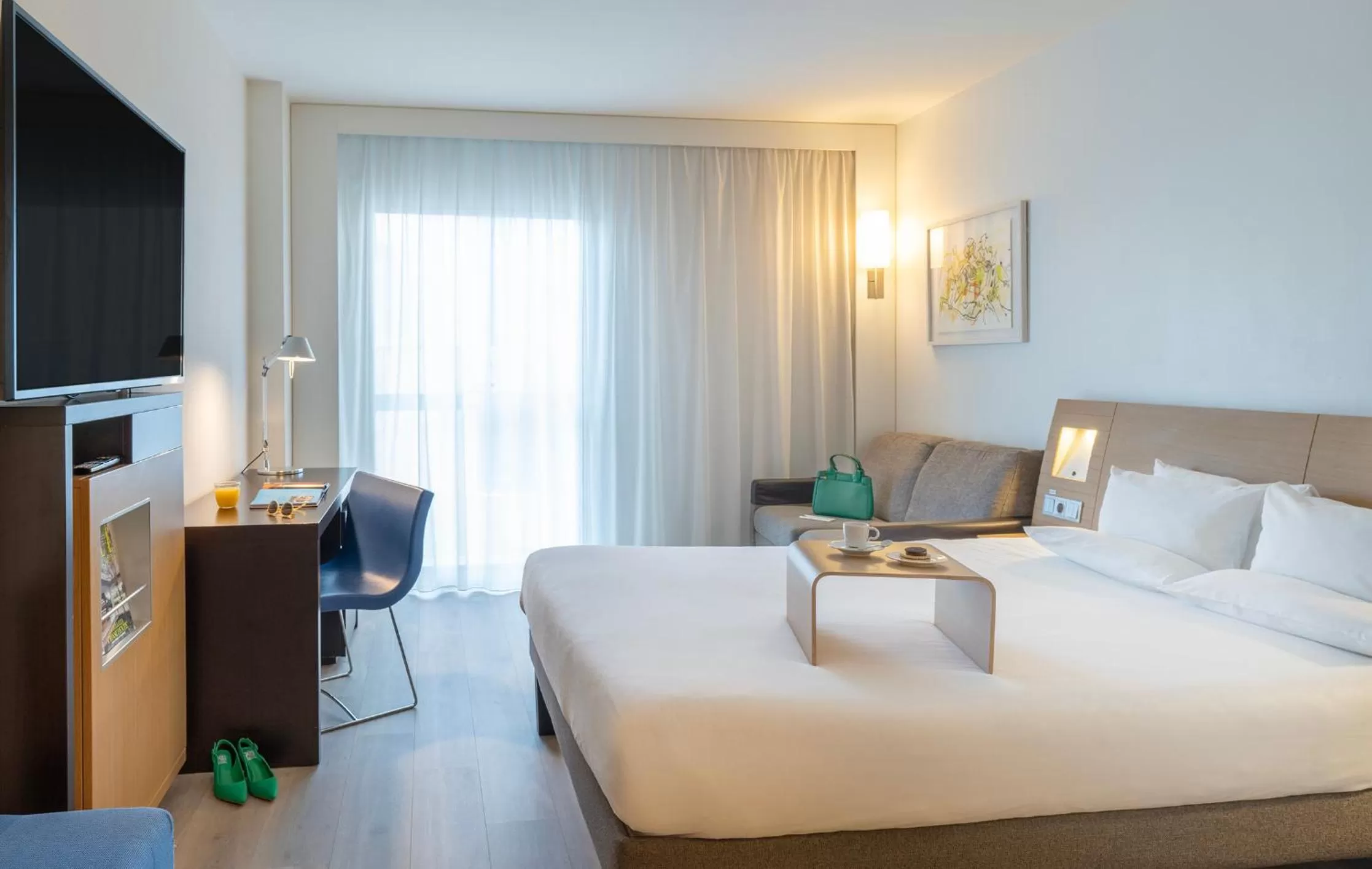 Bed in Novotel Barcelona City