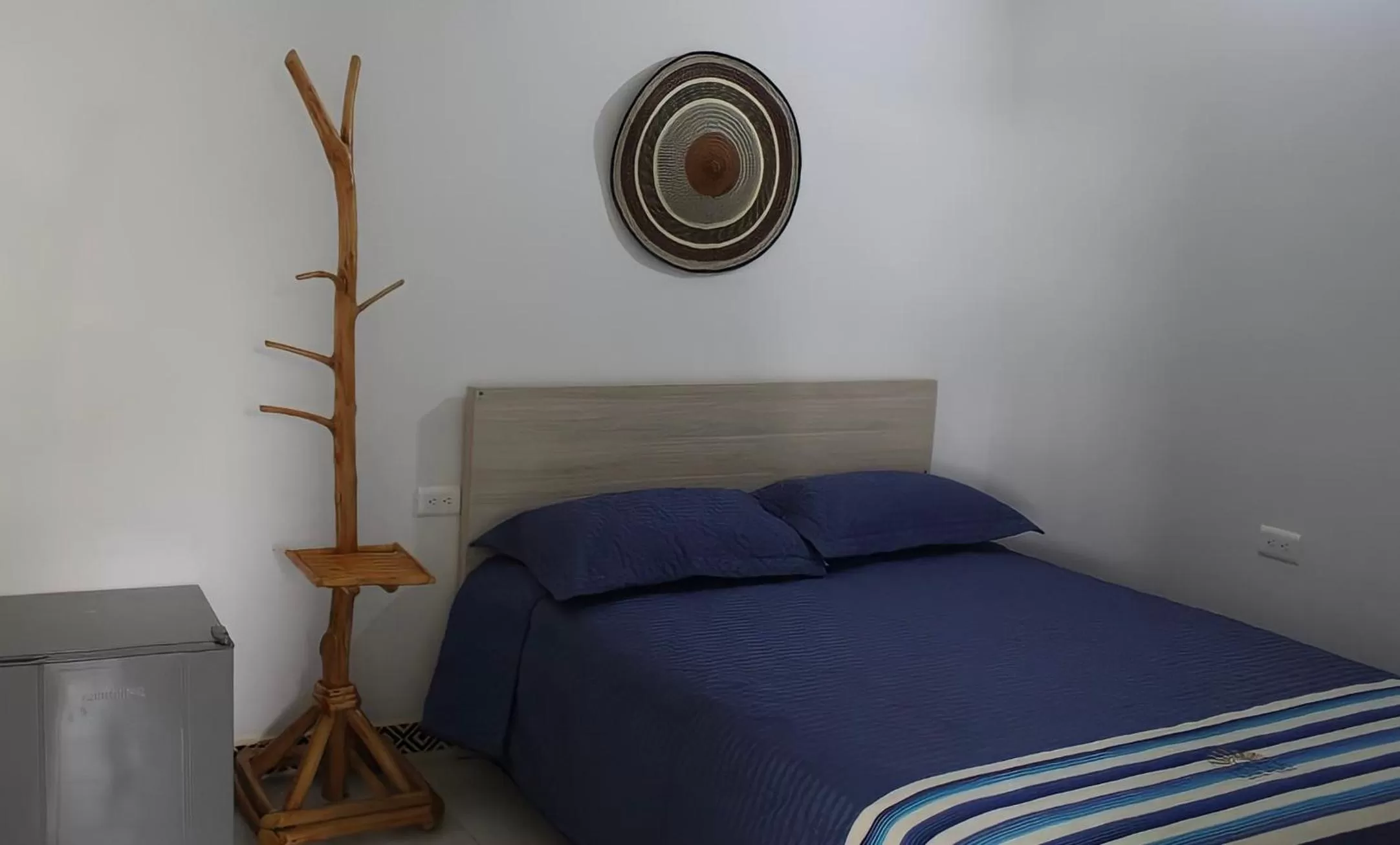 Bed in Hotel Iraka Zenu