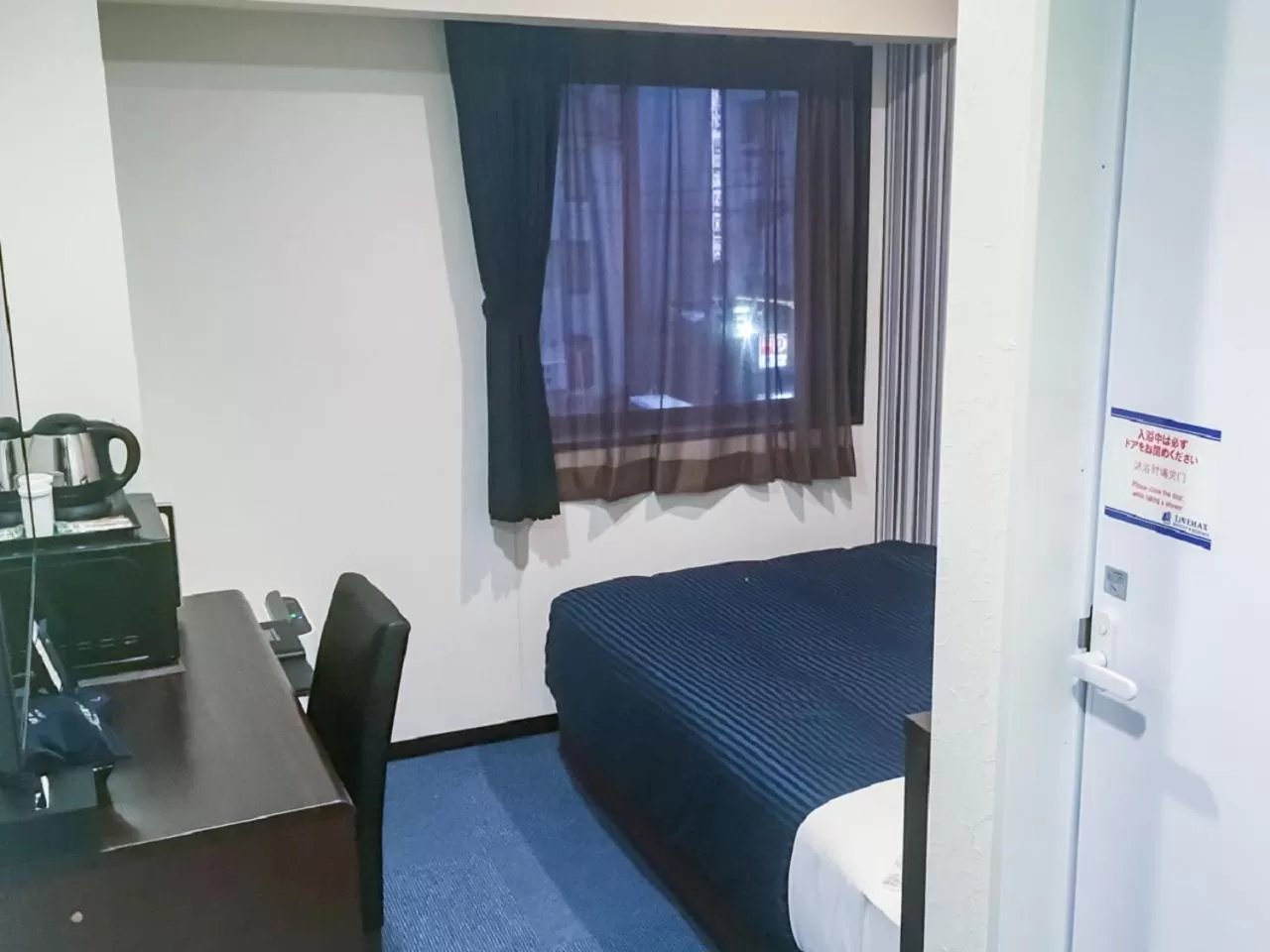 Bed in HOTEL LiVEMAX Yokkaichi Ekimae