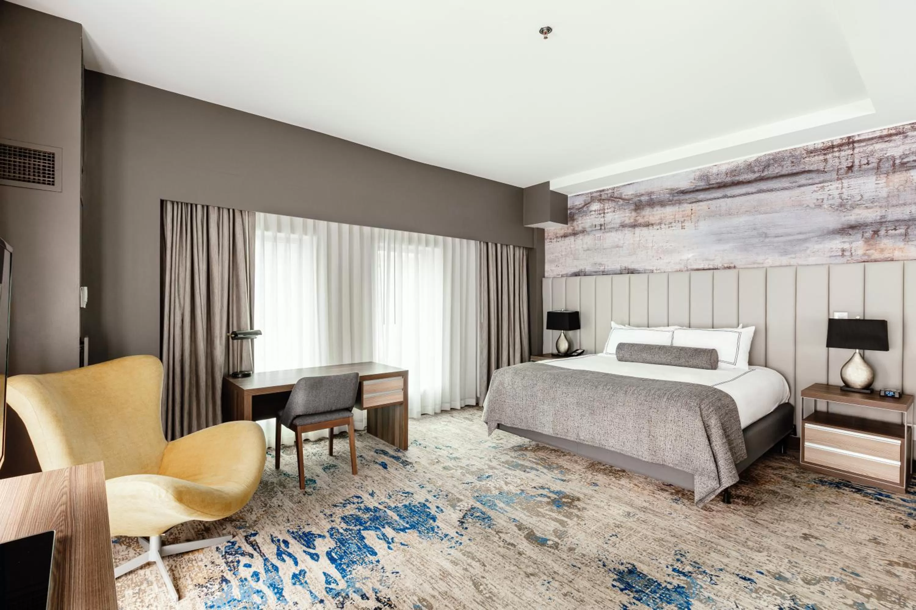 Bed in Atheneum Suite Hotel