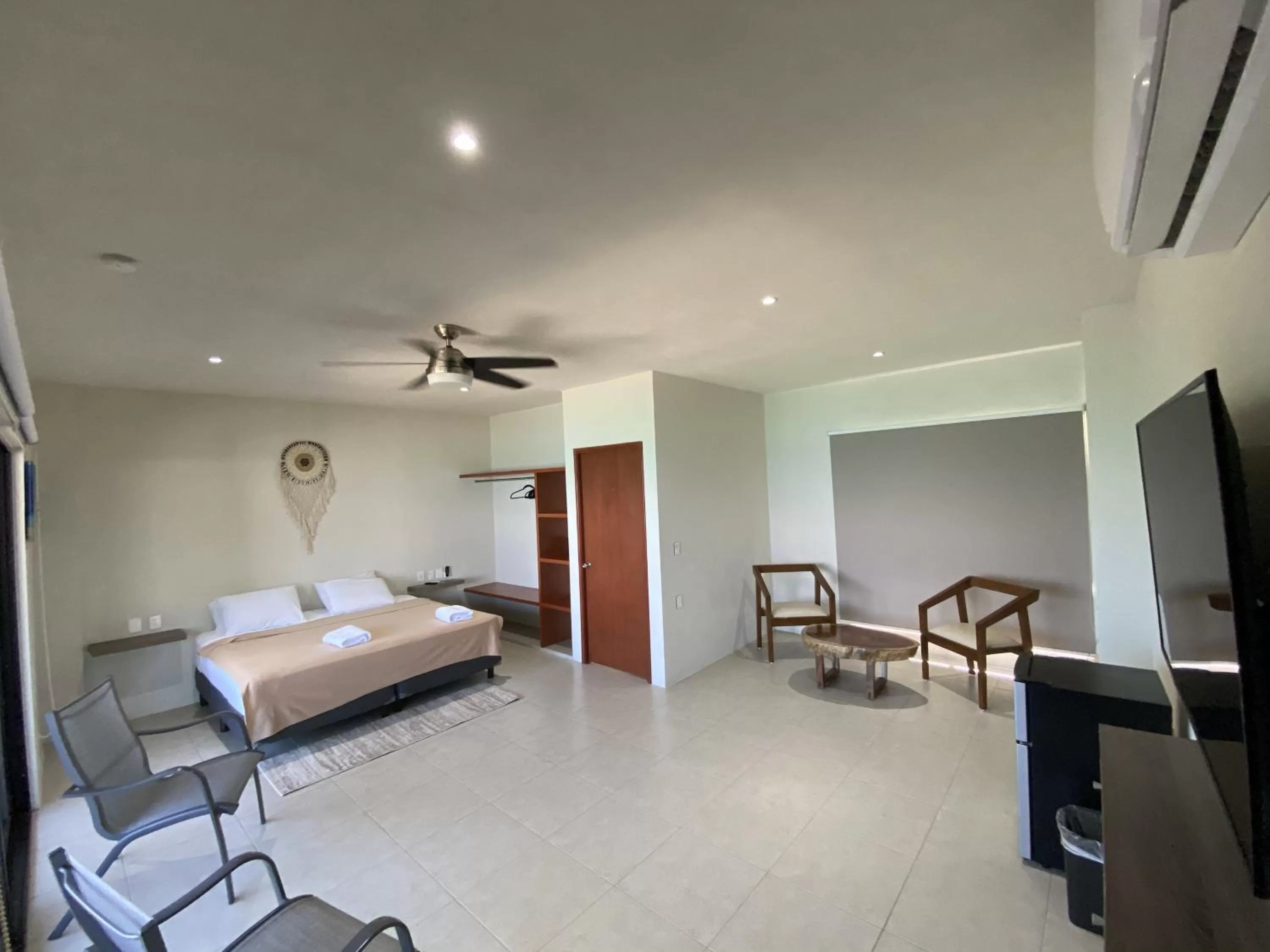 Photo of the whole room, Bed in Cuxos Hotel Beachfront