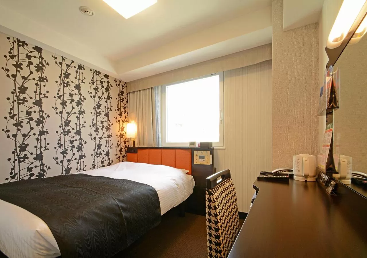 Photo of the whole room, Bed in APA Hotel Kagoshima Tenmonkan
