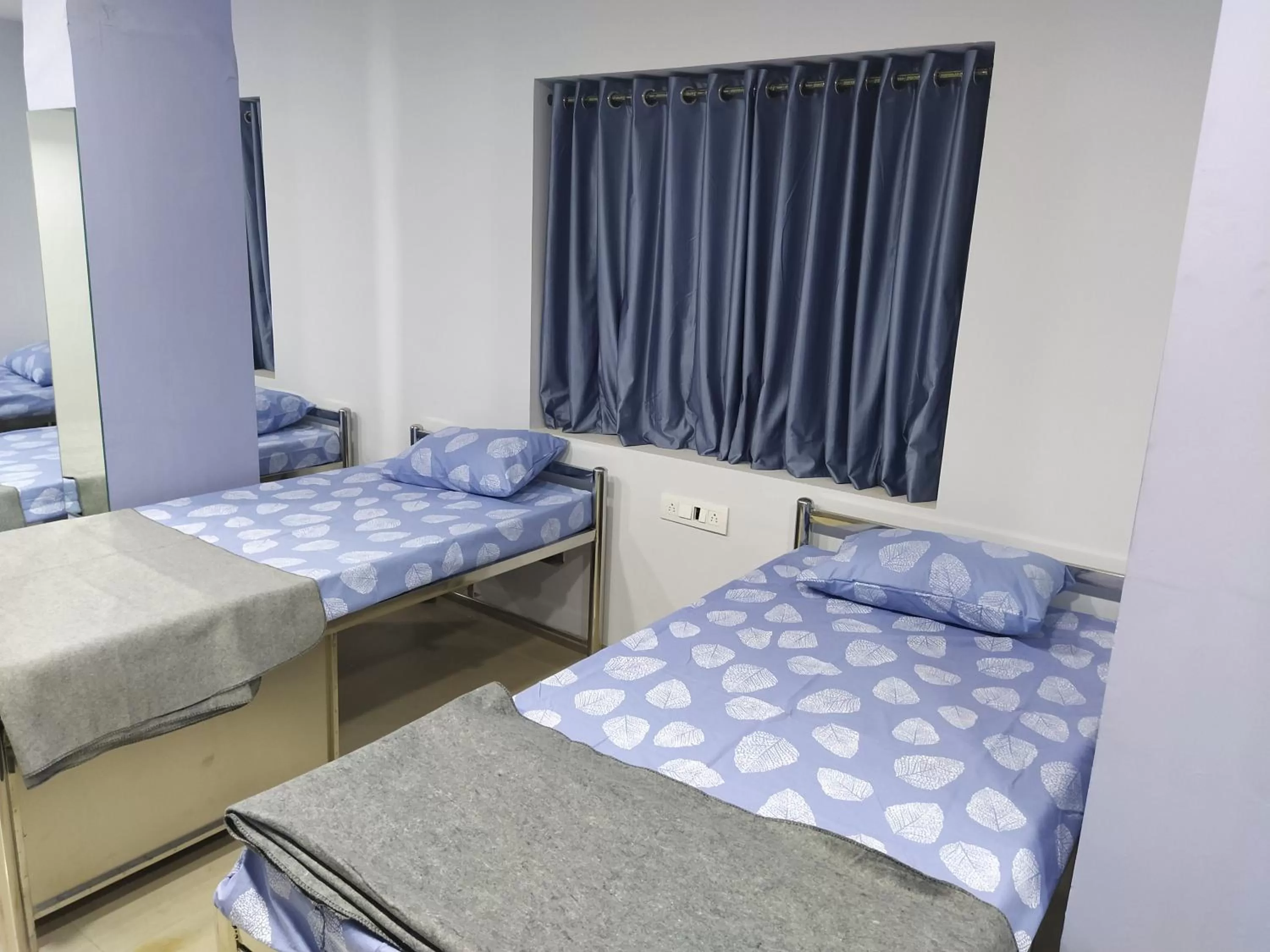 Bed in Shiv Sai Dormitory