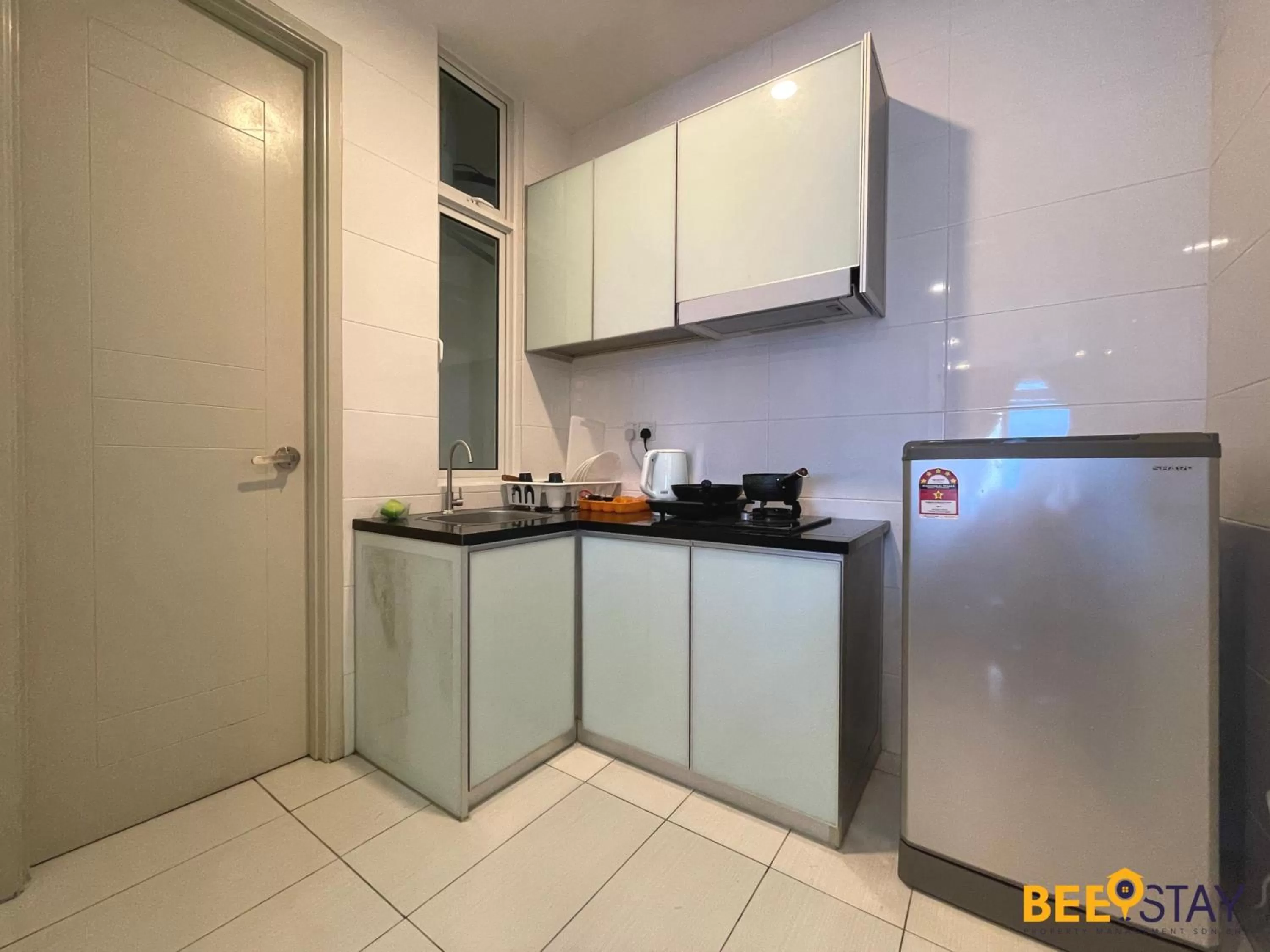 Kitchen/Kitchenette in The Wave Suites Melaka by BEESTAY