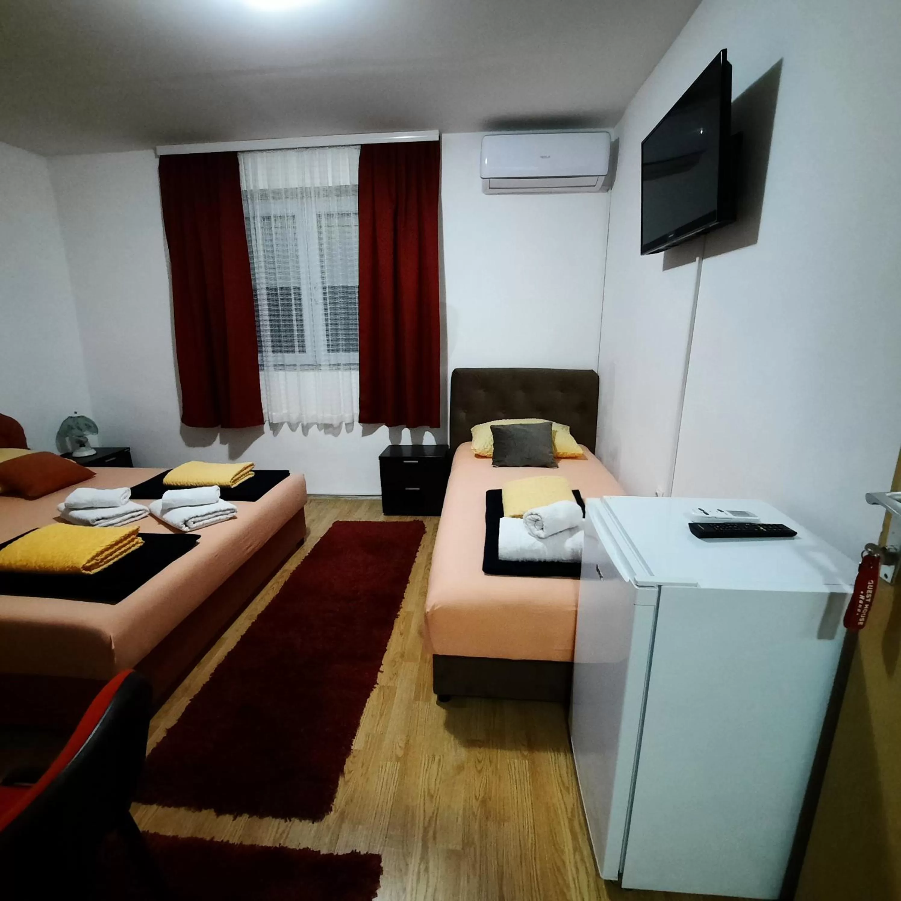 Bedroom, TV/Entertainment Center in Guest House Nana