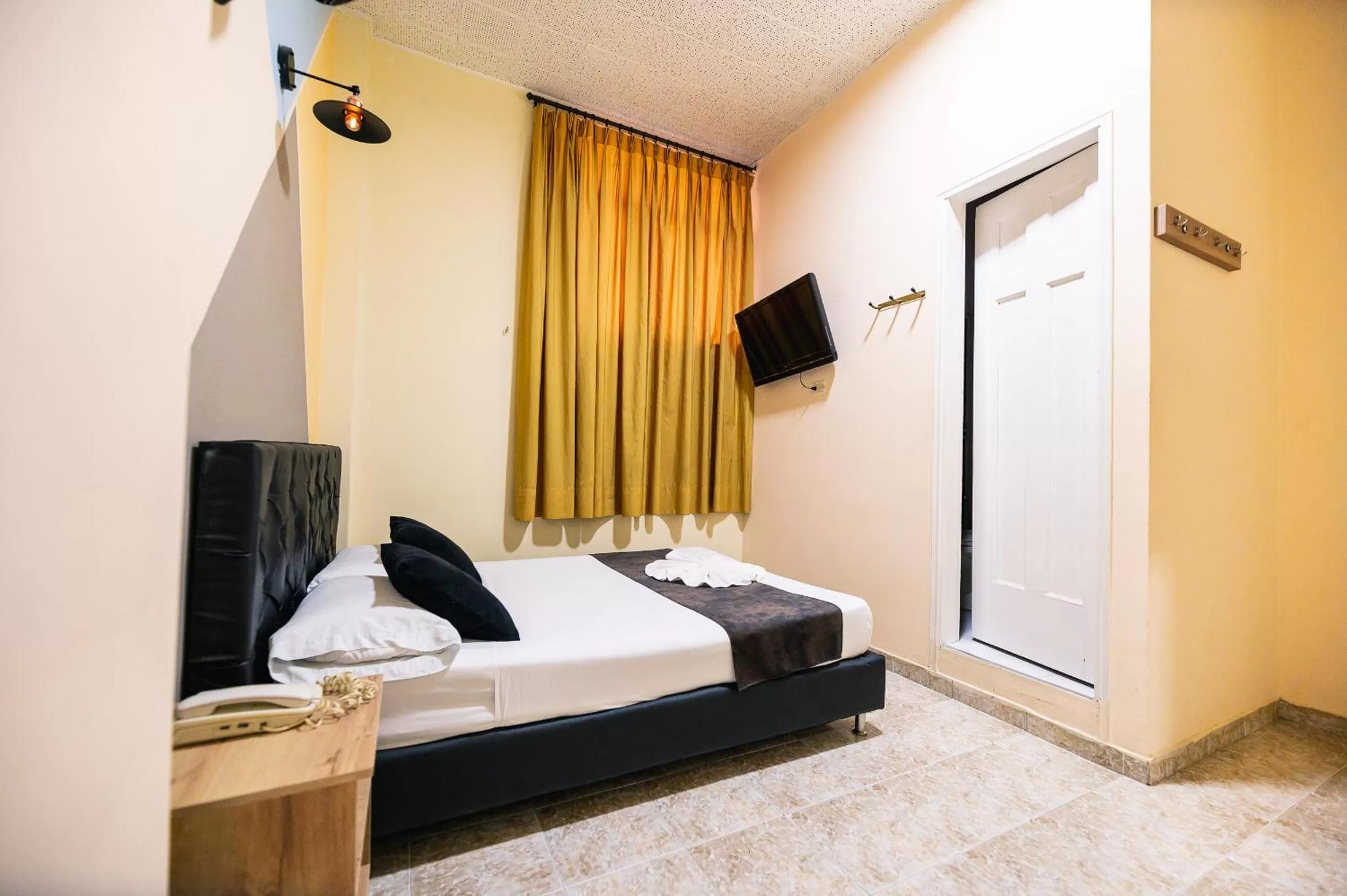 Bed in HOTEL CALLE REAL SUITE