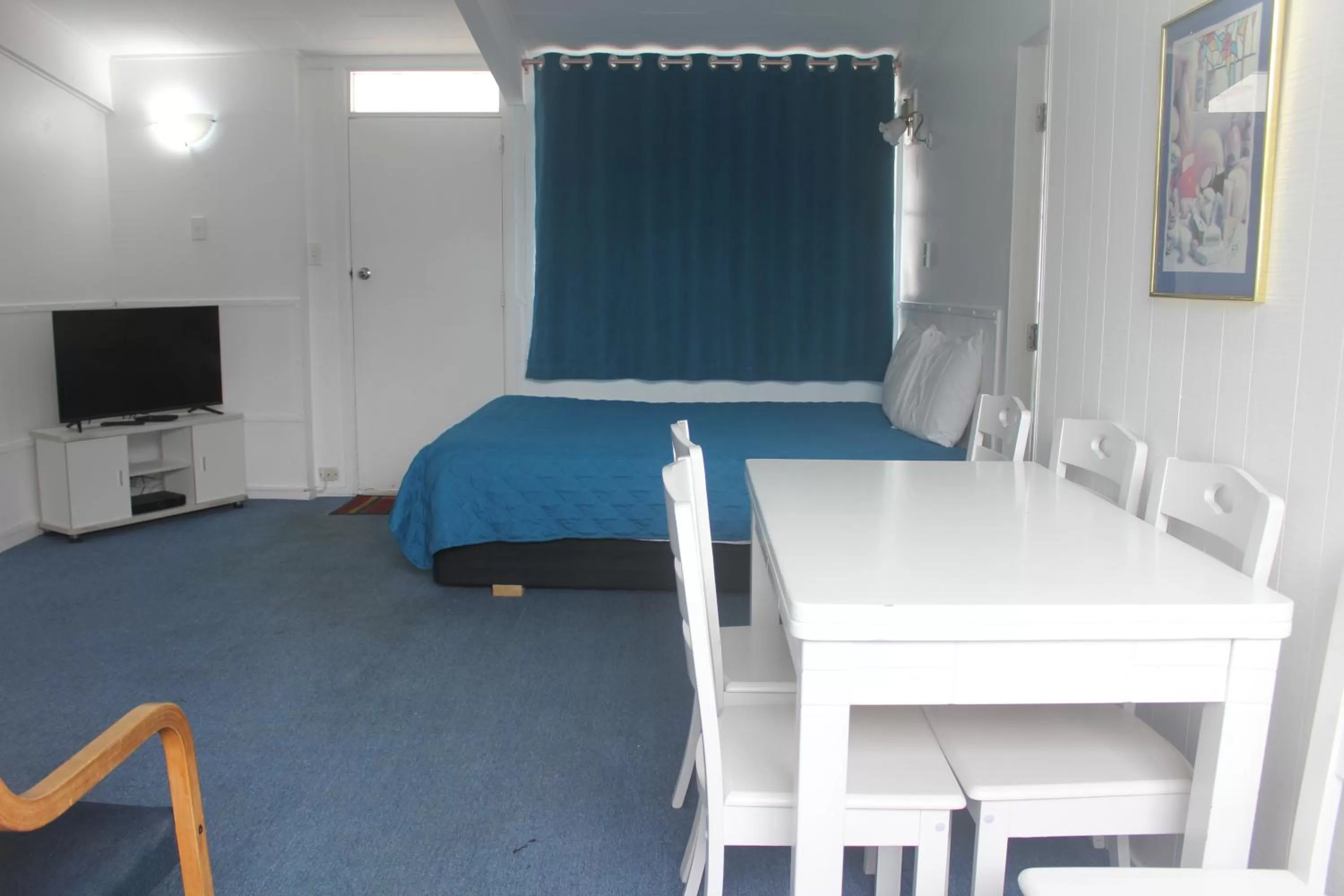 Bed in Golden Glow Motel