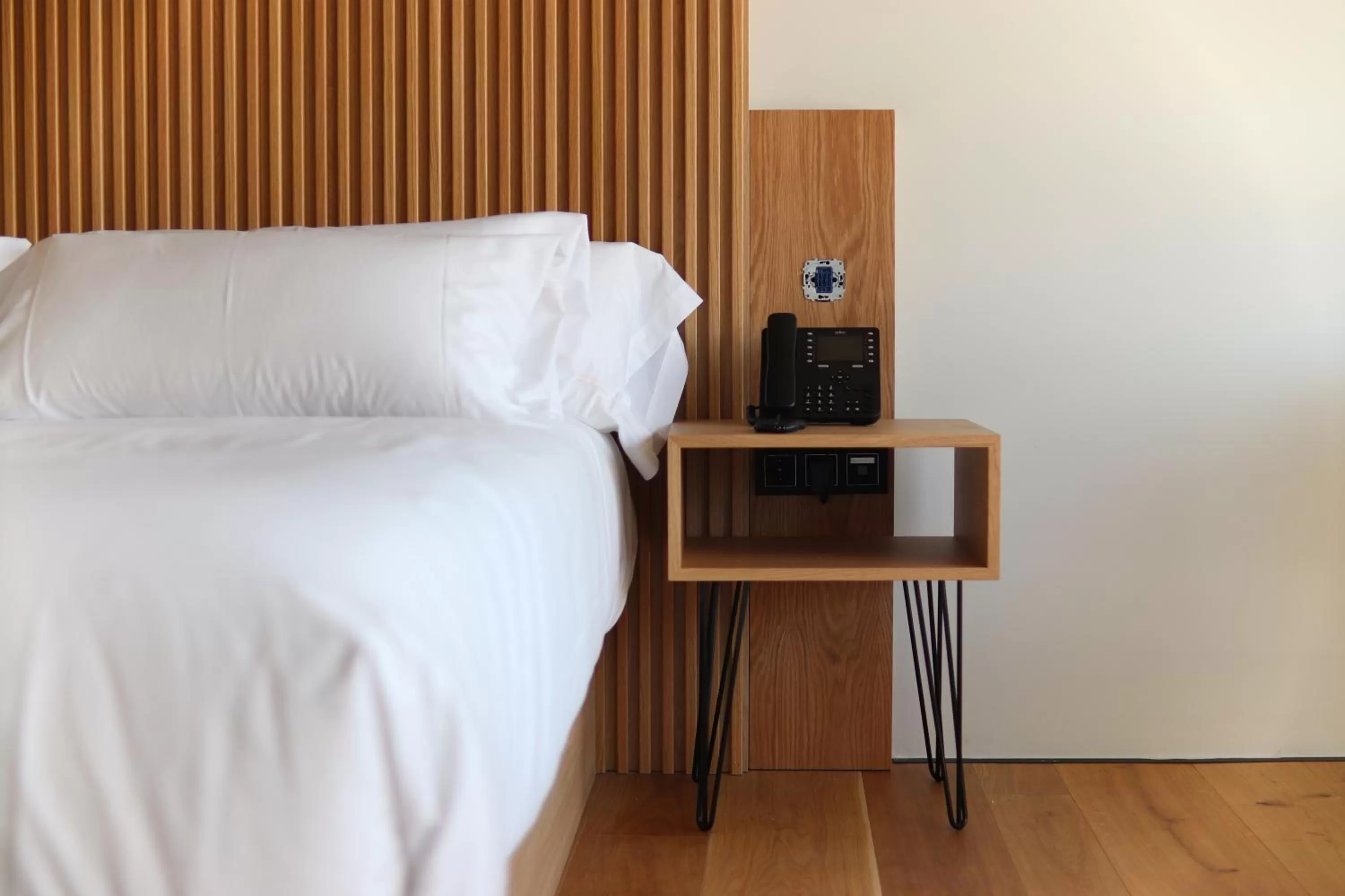 Bed in Atmos Hotel Boutique