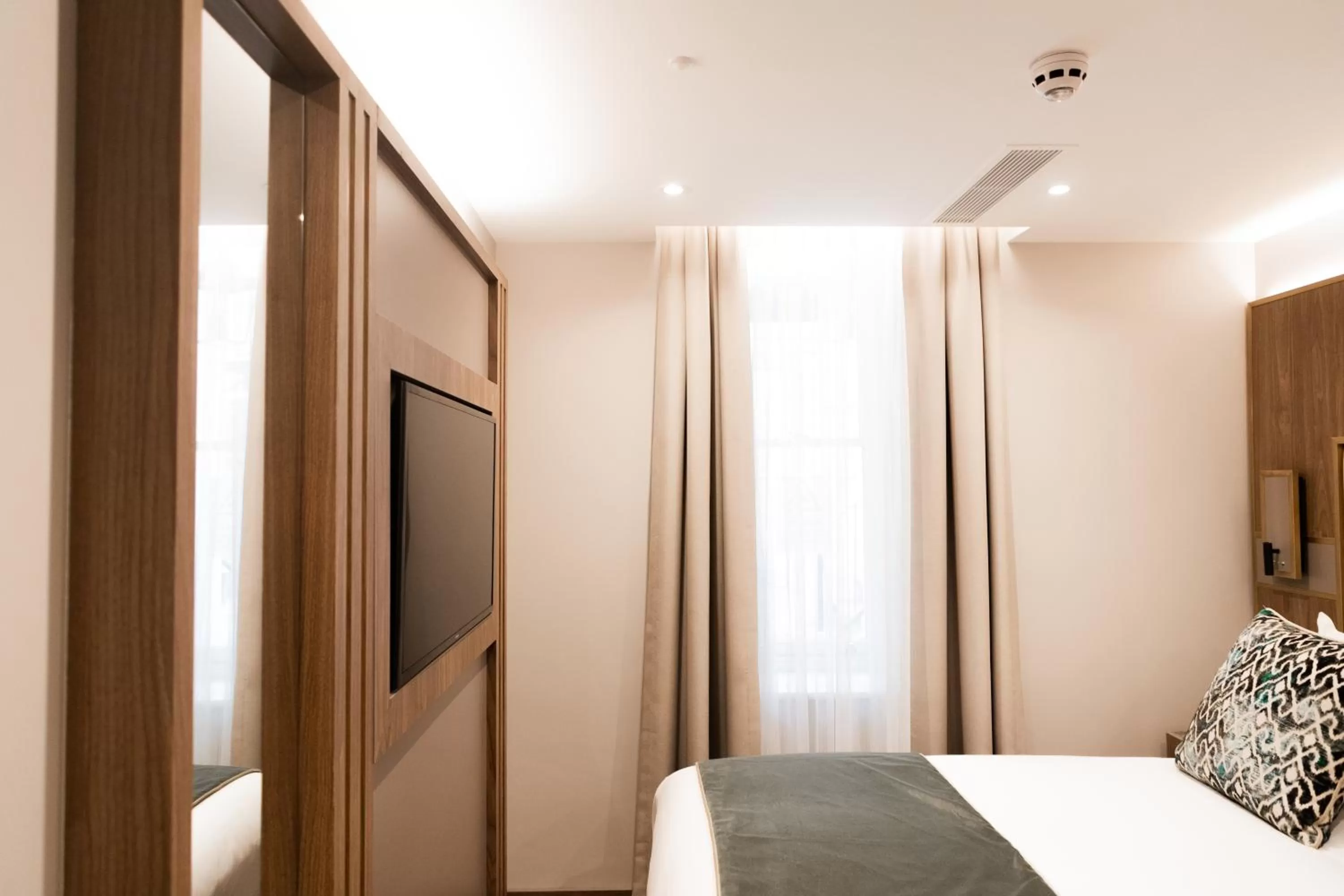 Bed in Merit Kensington Hotel