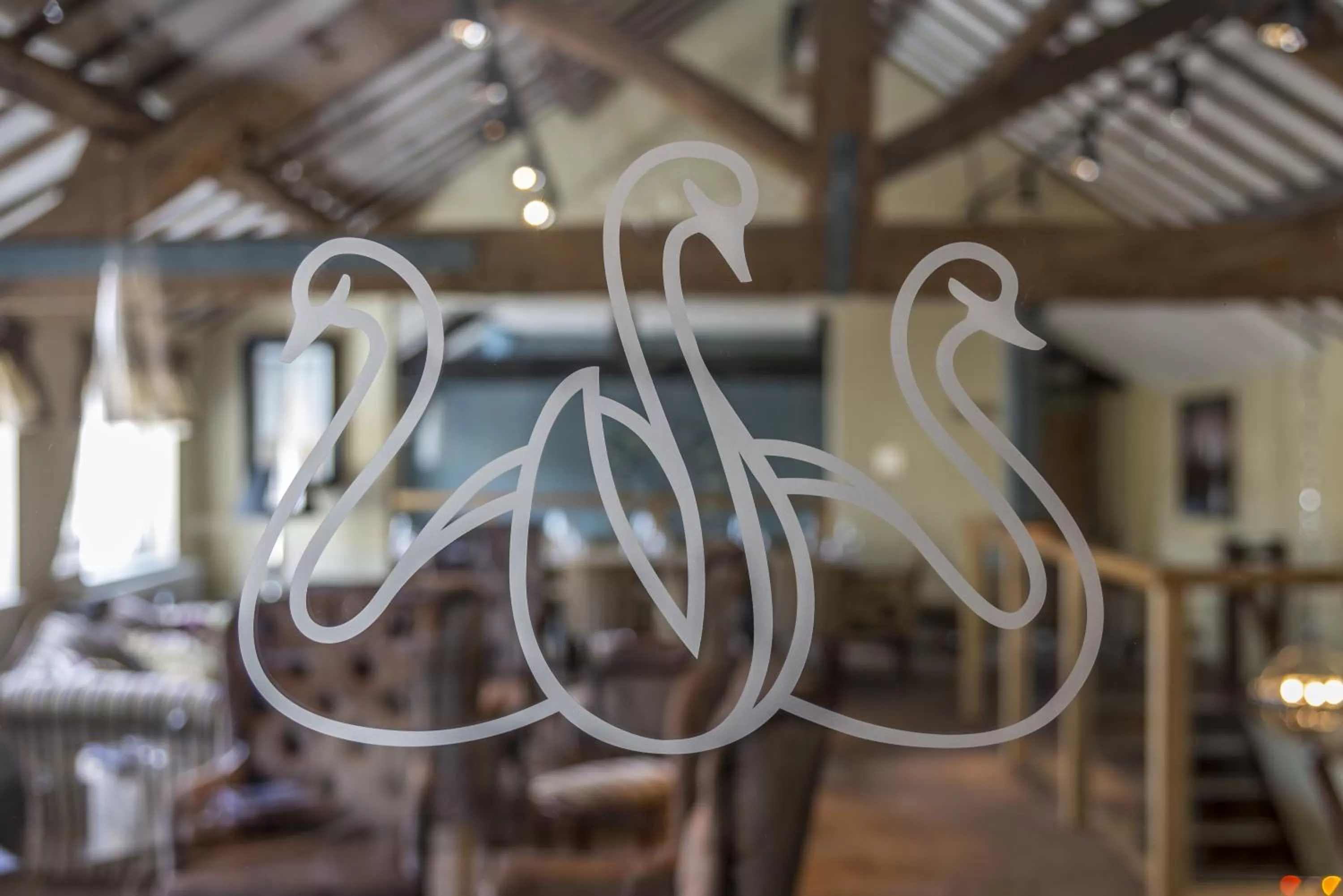 Property logo or sign in The Three Swans Hotel, Market Harborough, Leicestershire - The Coaching Inn Group