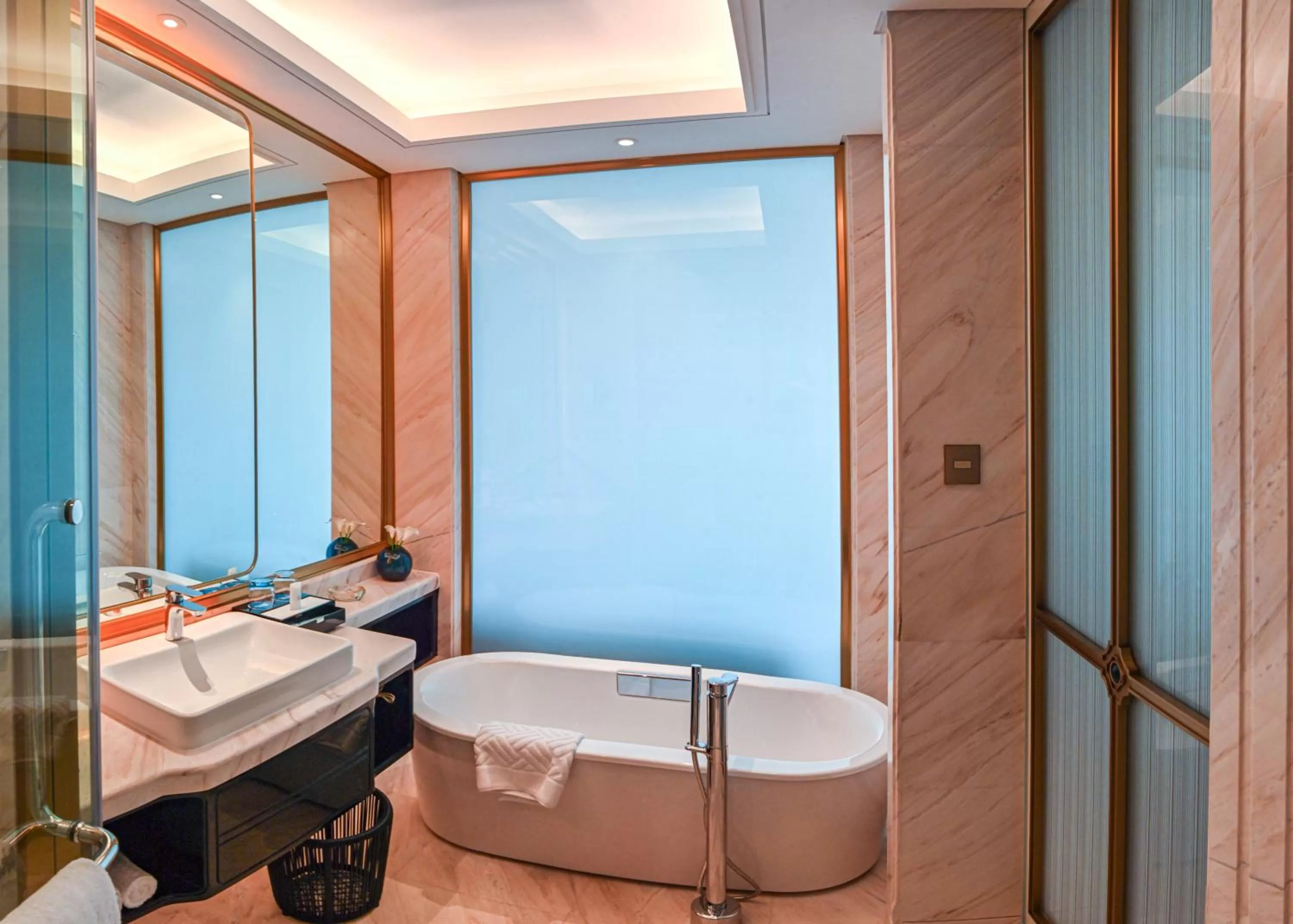 Bathroom in Wyndham Qingdao l Free Fixed-Time Shuttle Service Between Hotel and Airport & North Railway Station l Outdoor Children's Amusement Park l 1-Hour Play Snooker or Table Tennis
