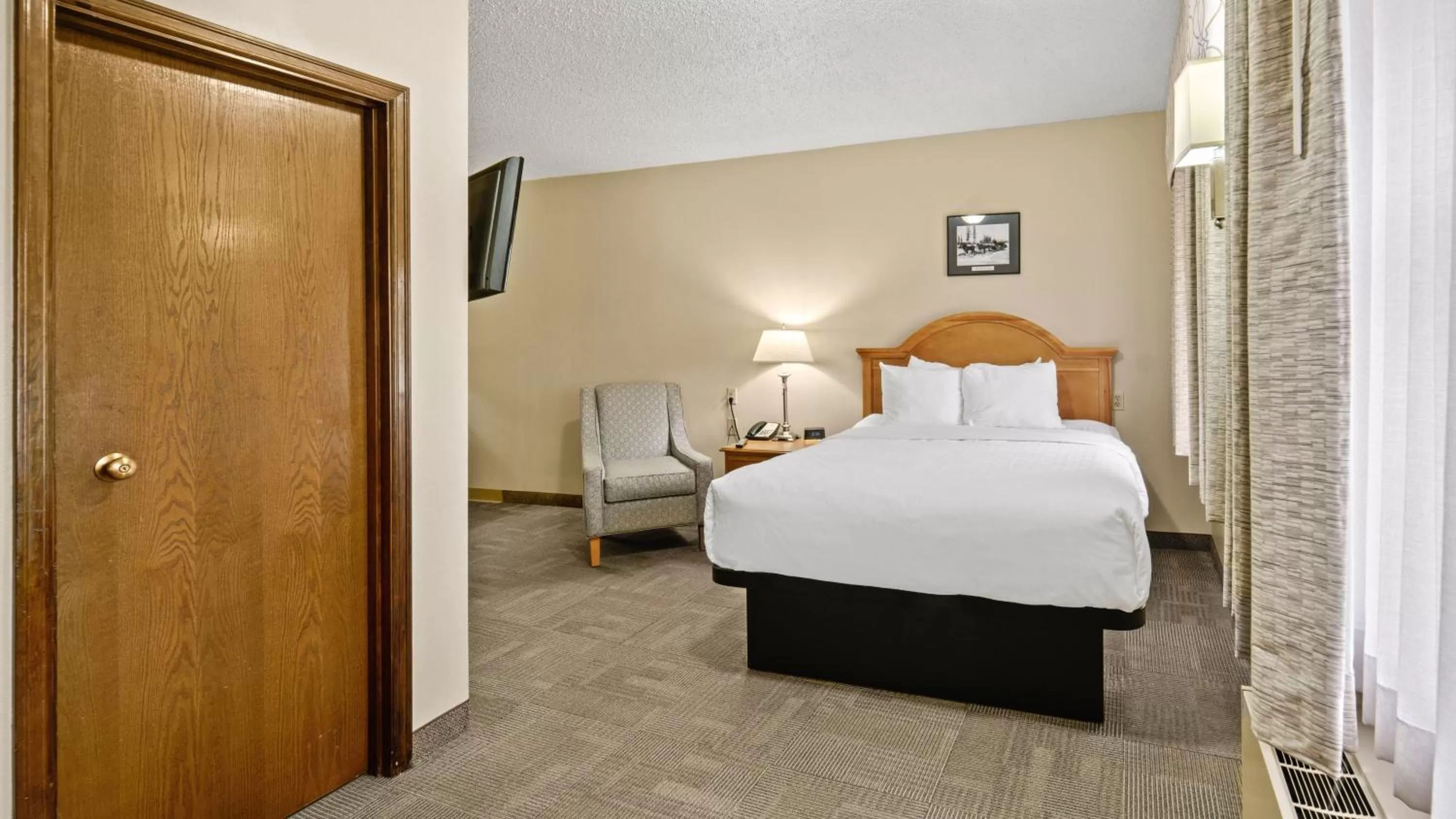 Photo of the whole room, Bed in Clarion Hotel & Suites Fairbanks near Ft Wainwright