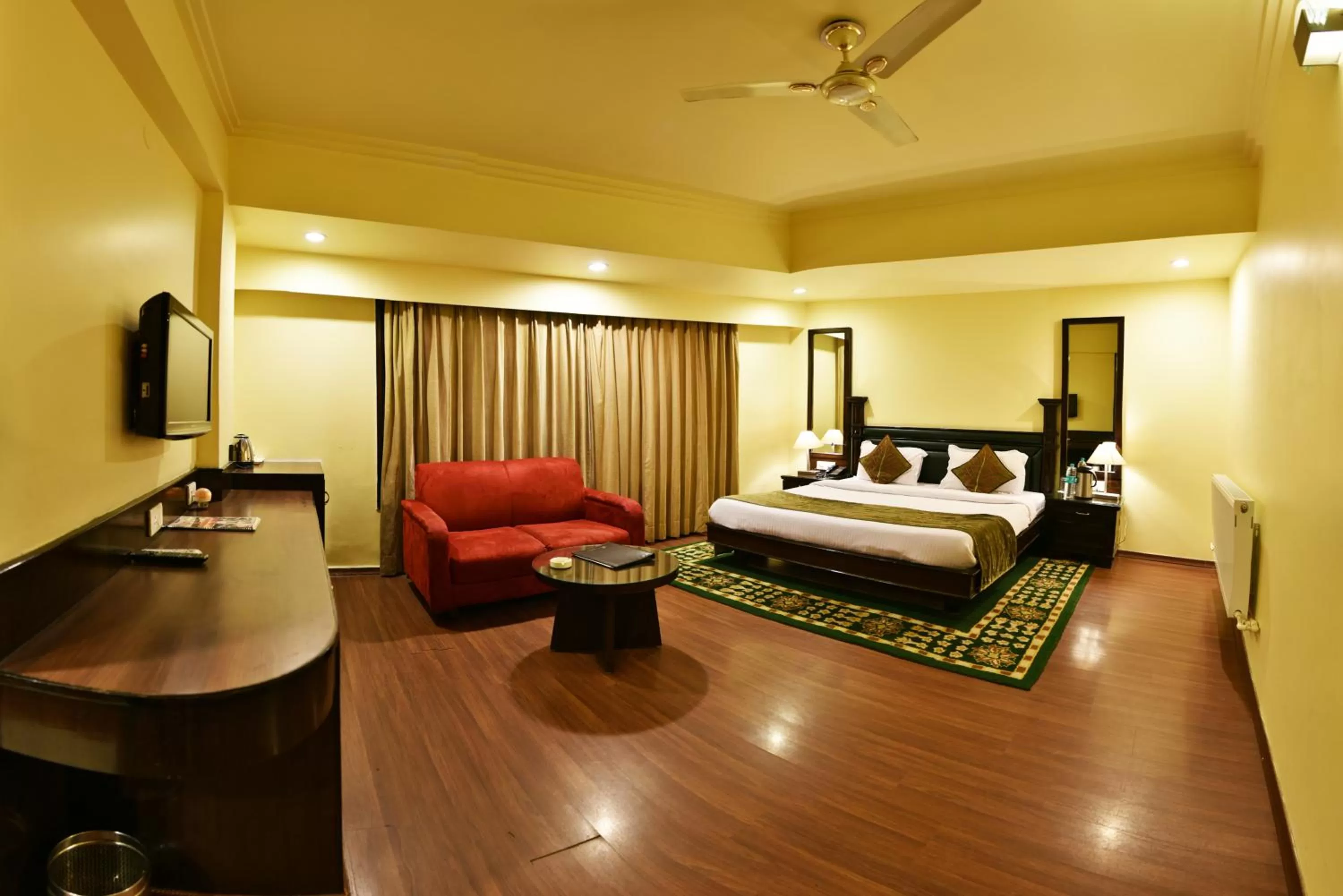 Photo of the whole room, Bed in Indraprastha Resort - Centrally Heated Rooms, with Gym, Games & Spa