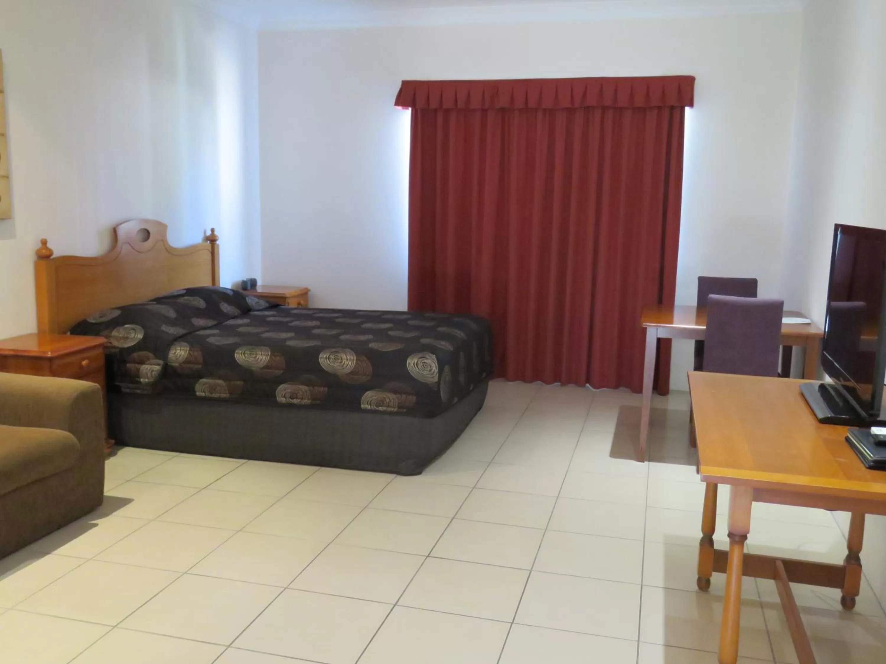 Bed in Emerald Gardens Motel & Apartments