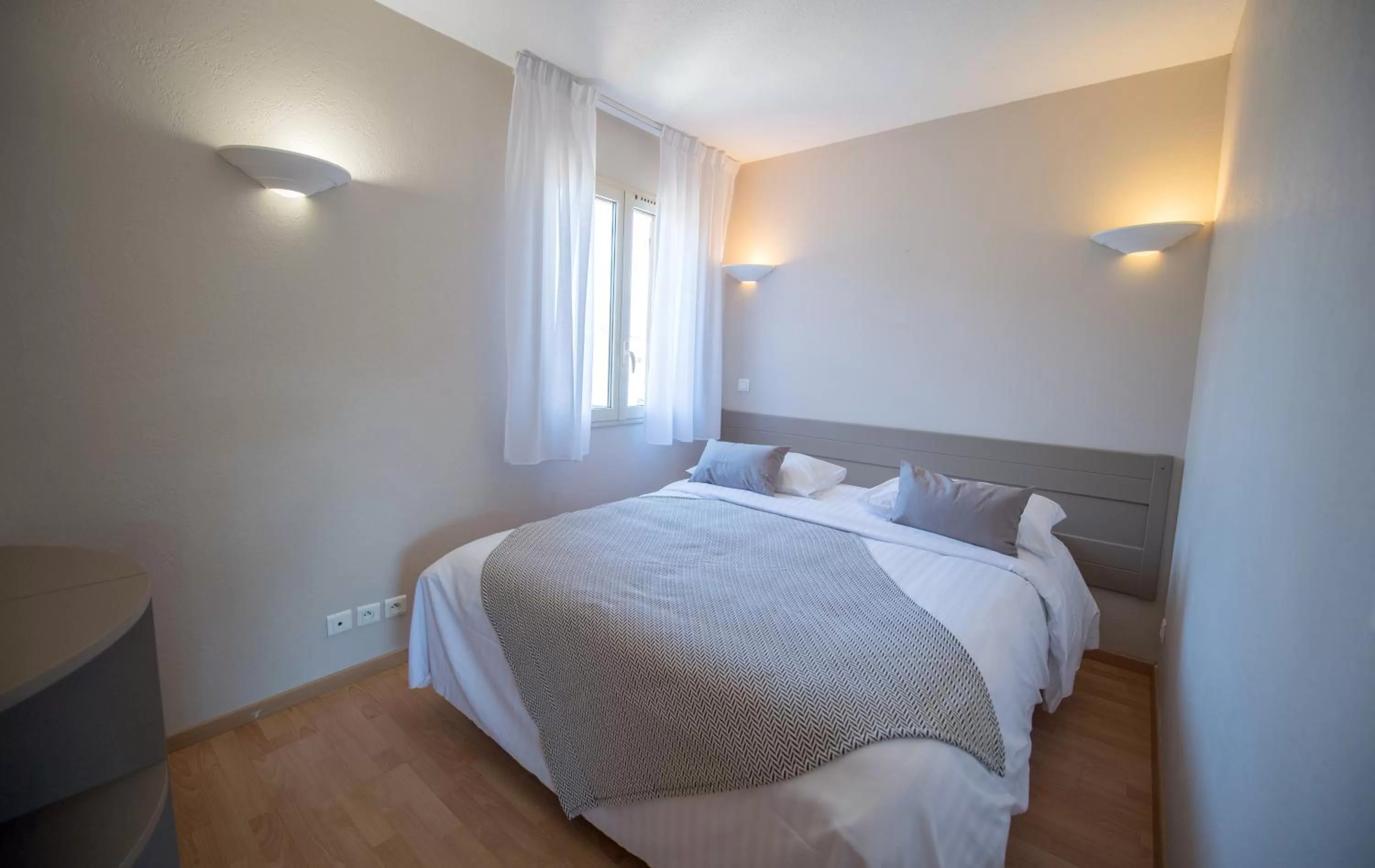 Bed in Appart Hotel Lou Castelet