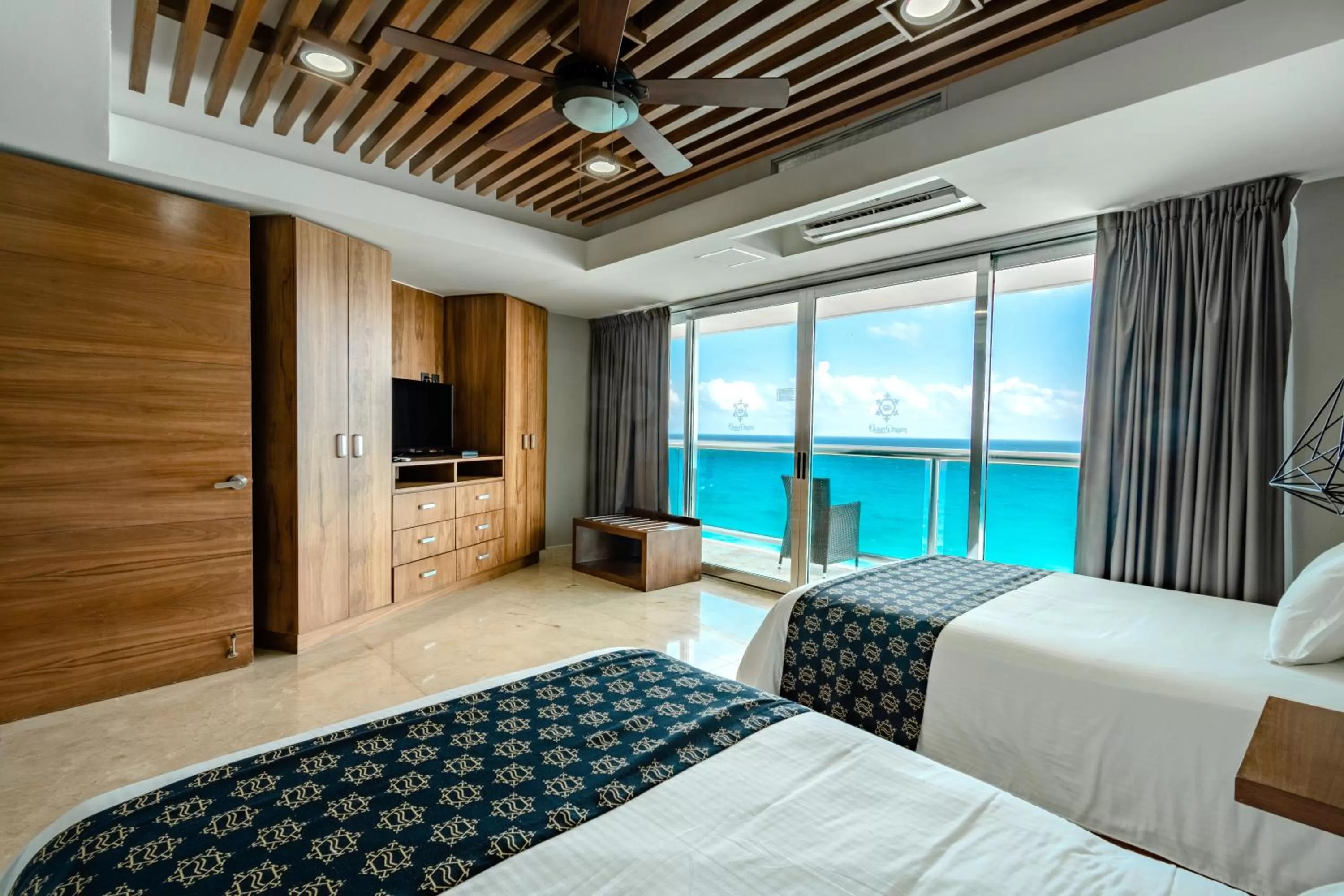 Bed in Ocean Dream Cancun by GuruHotel