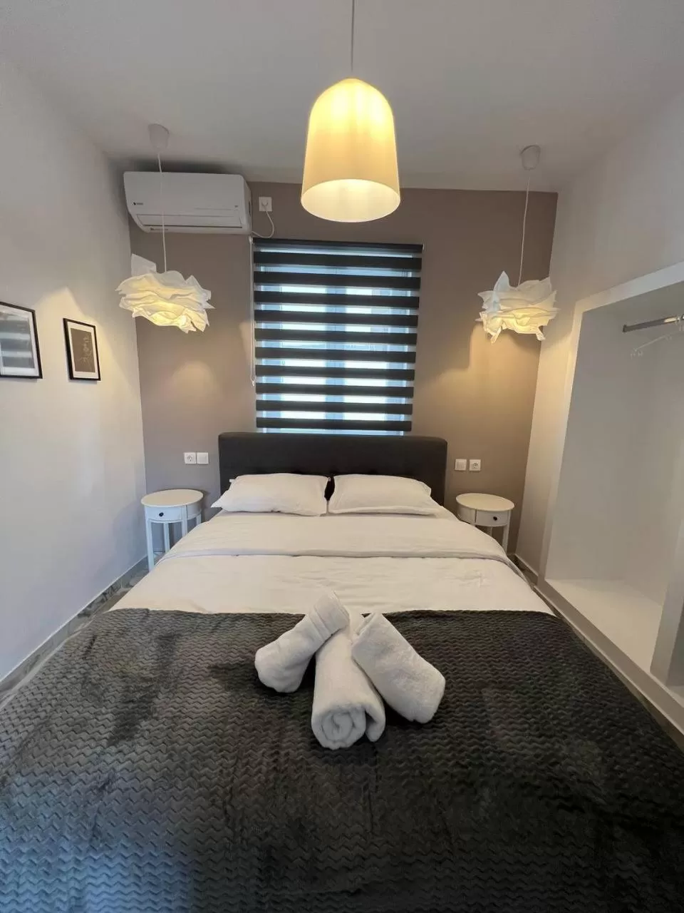 Bed in Elefsinian Mysteries Apartments