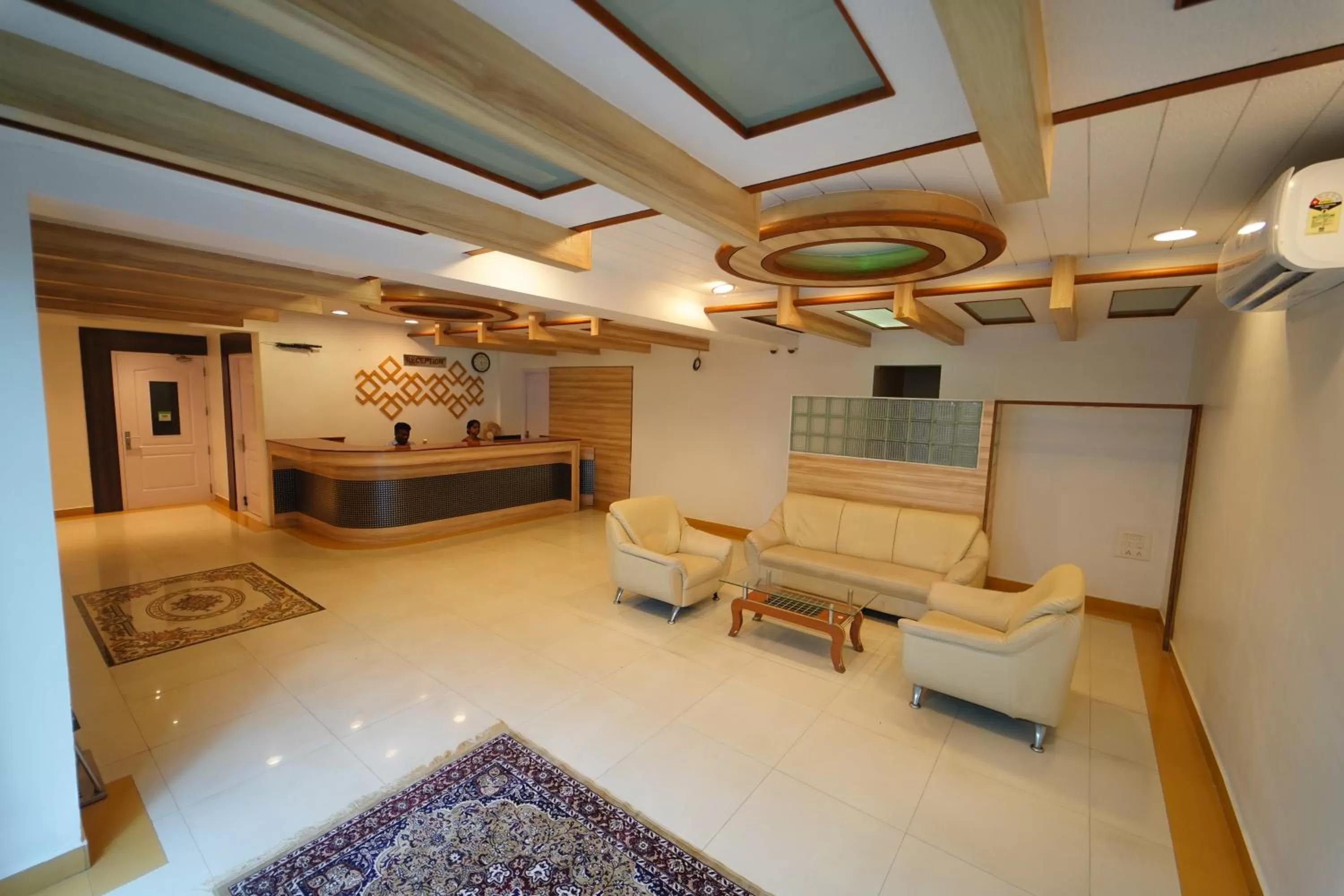 Lobby or reception in Hotel Palmyra Grand Inn