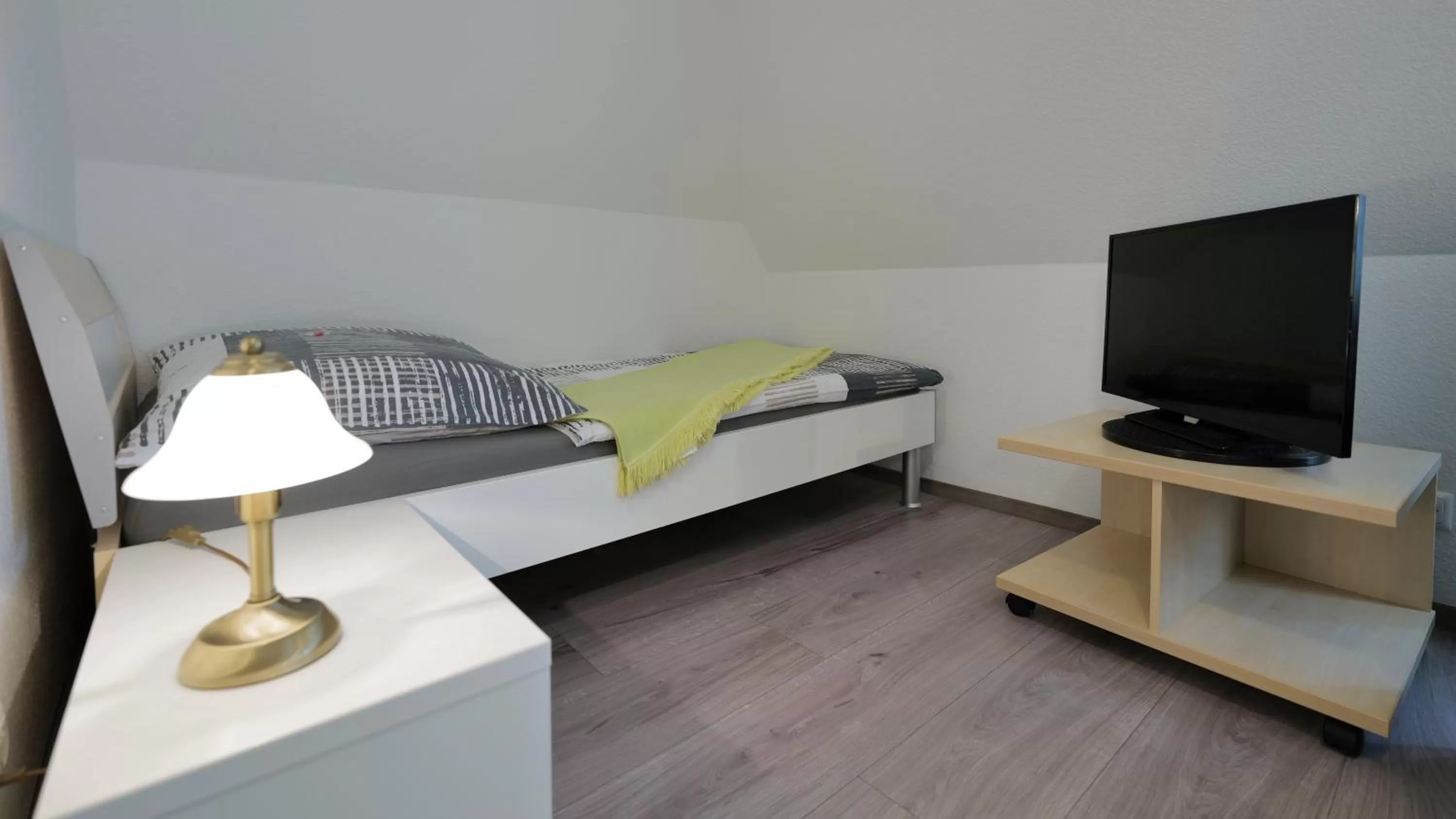 Bed in Elena Kempf Haaratelier & Guesthouse