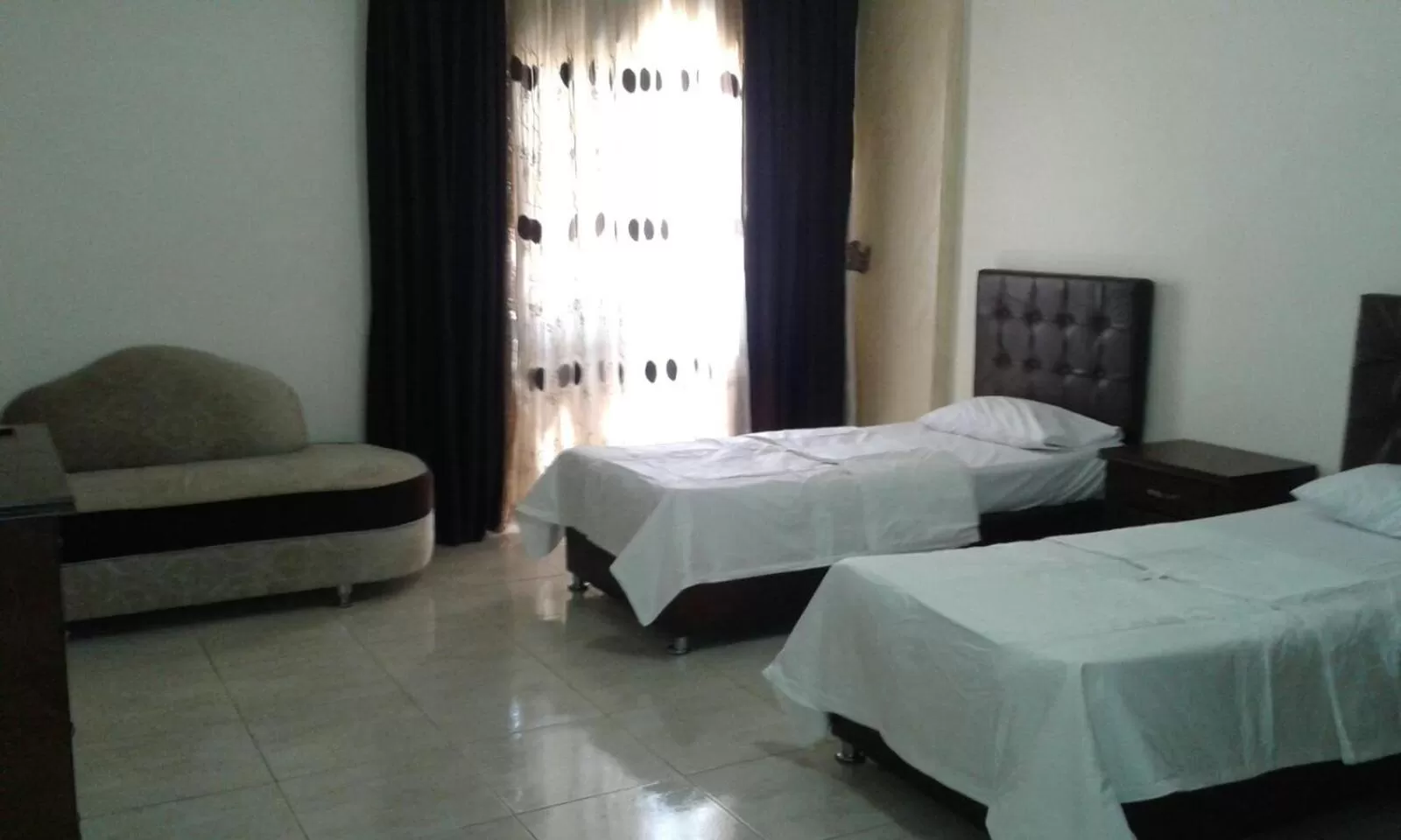 Bed in Al Tawheed Hotel Apartments