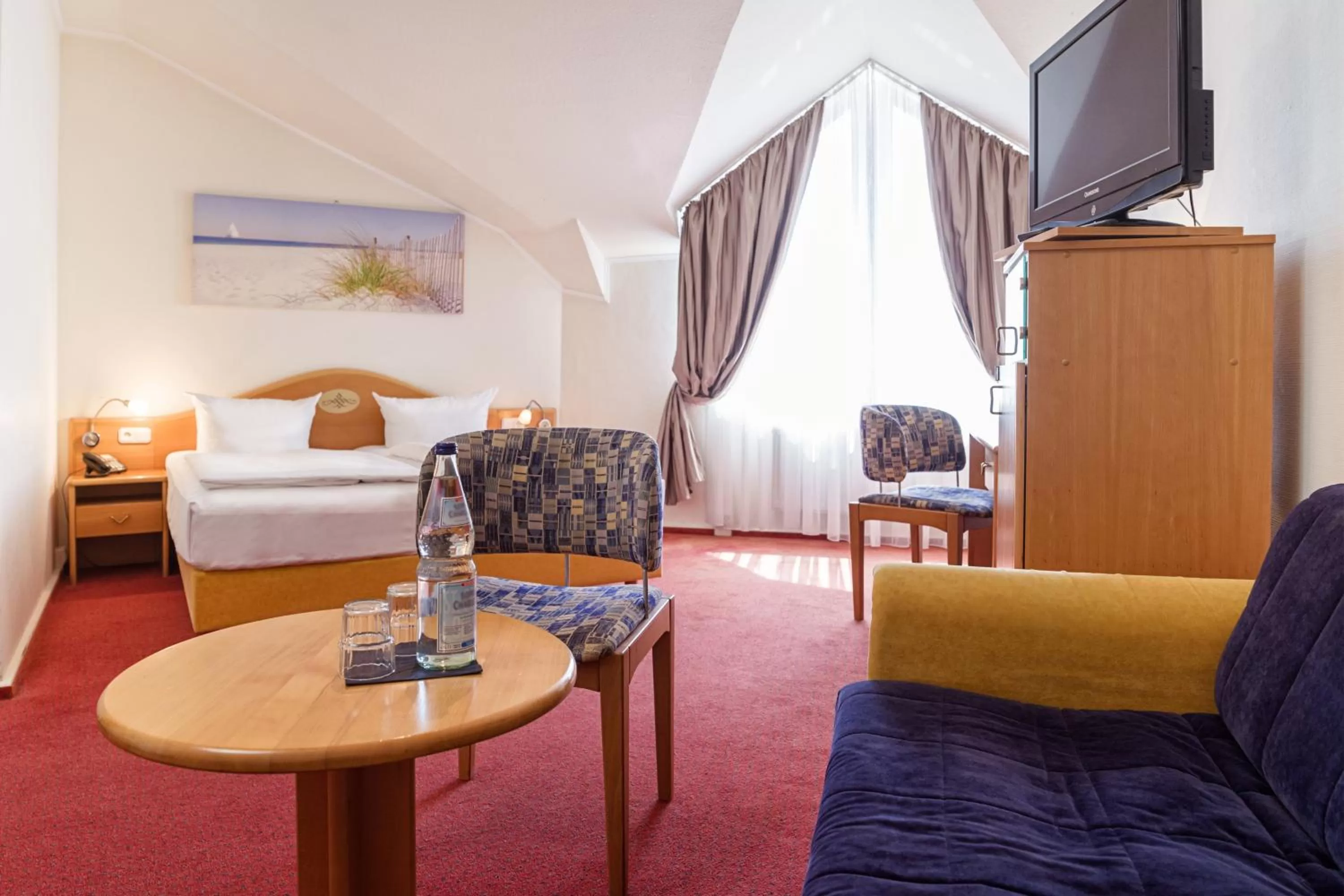 Photo of the whole room, Bed in Hotel Dänischer Hof Altenholz by Tulip Inn