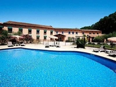 Swimming pool in Logis Hôtel Le Mas De Jossyl