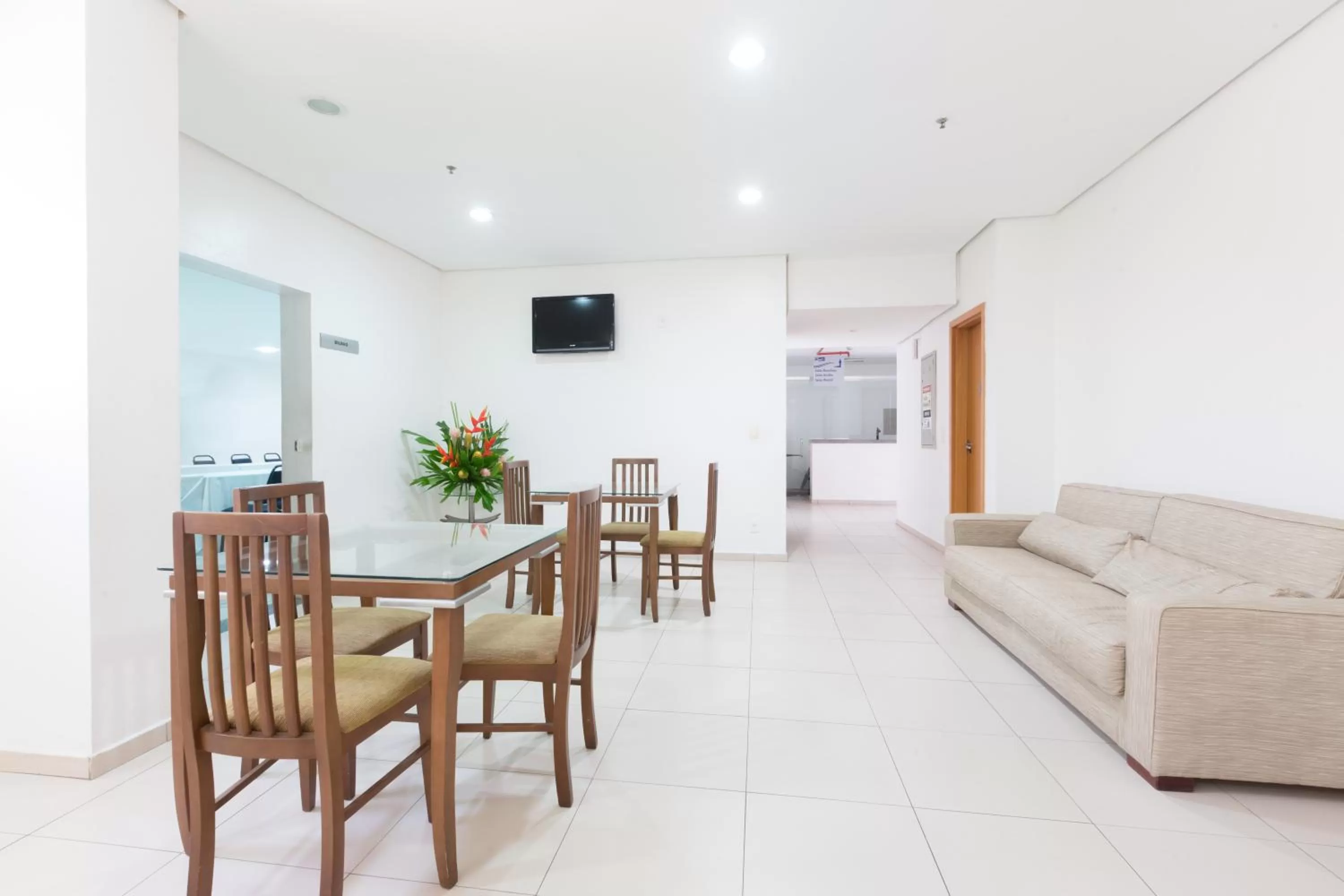 Communal lounge/ TV room in Arrey Executive Hotel