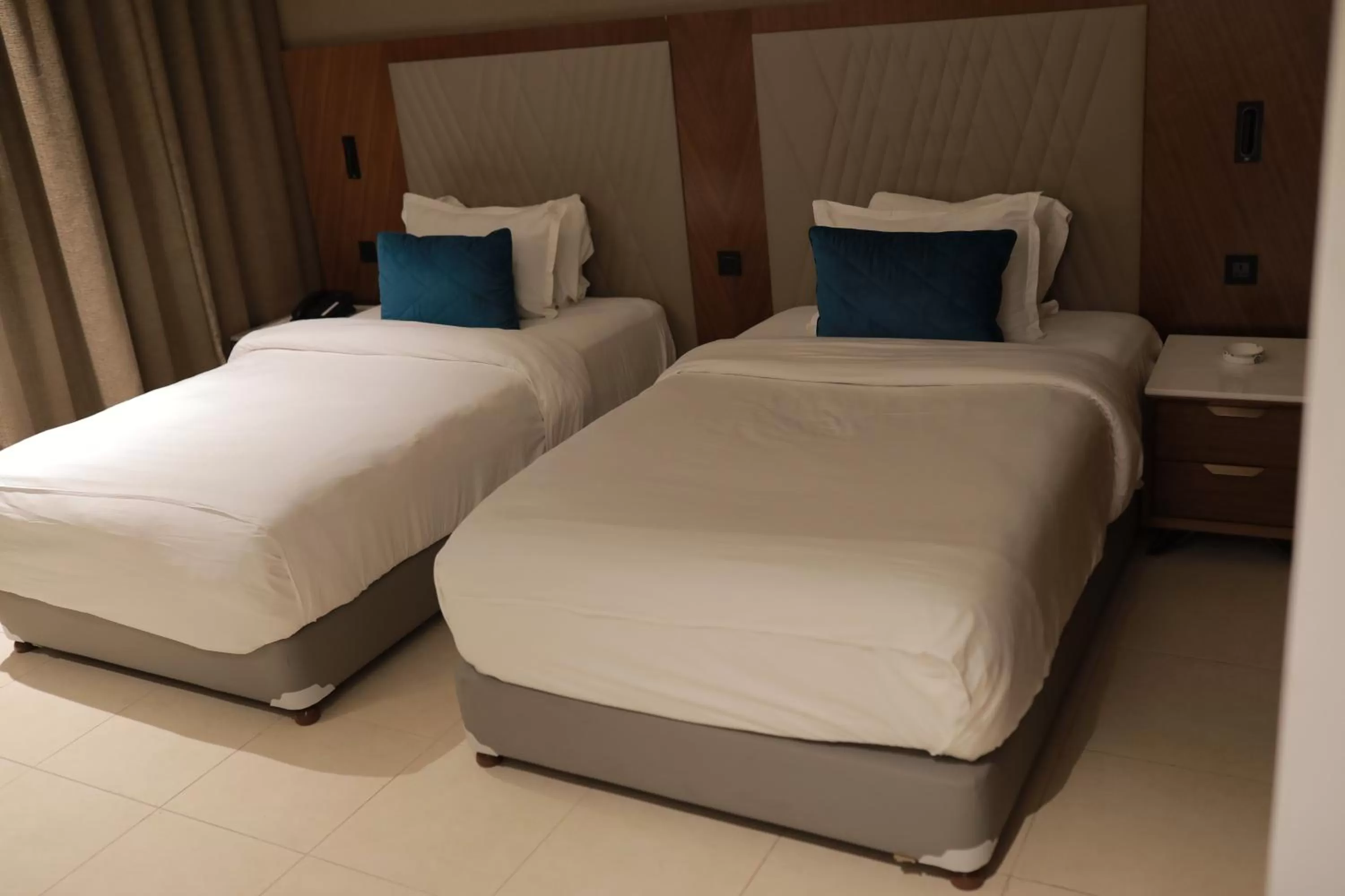 Bed in Ramee Palace Hotel