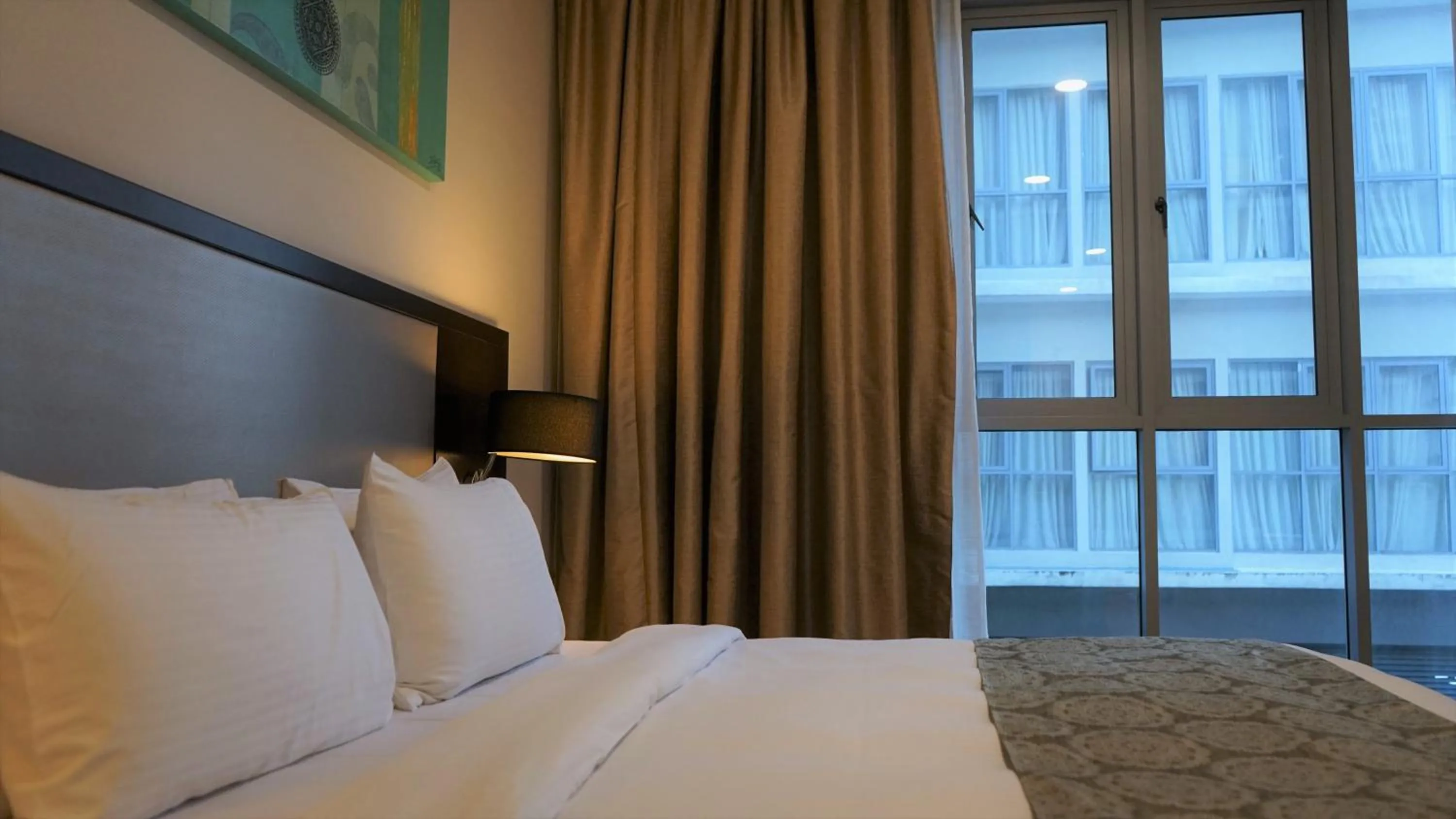 Bed in Trinidad Suites Johor, Trademark Collection by Wyndham