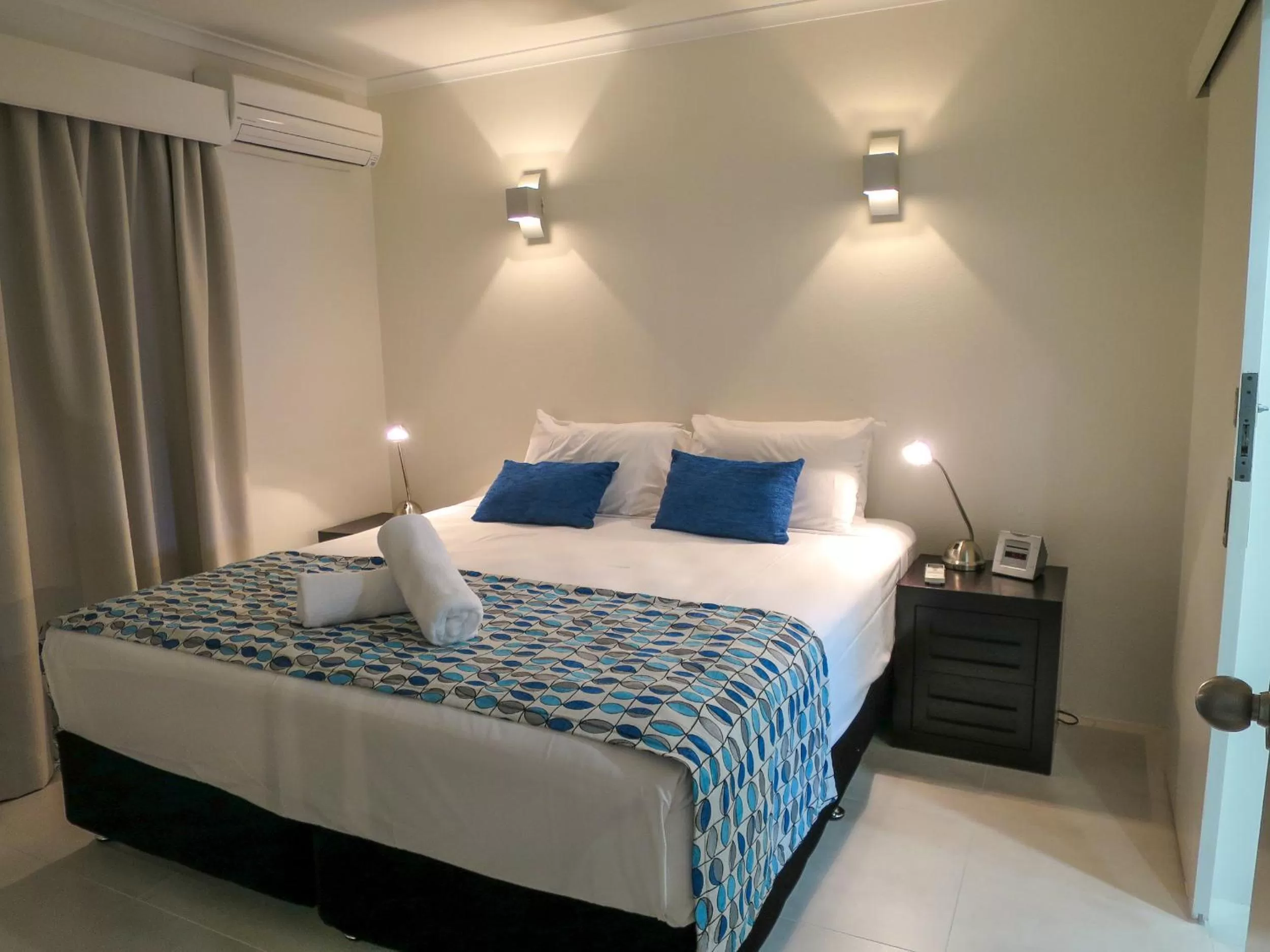 Bed in Marlin Waters Beachfront Apartments