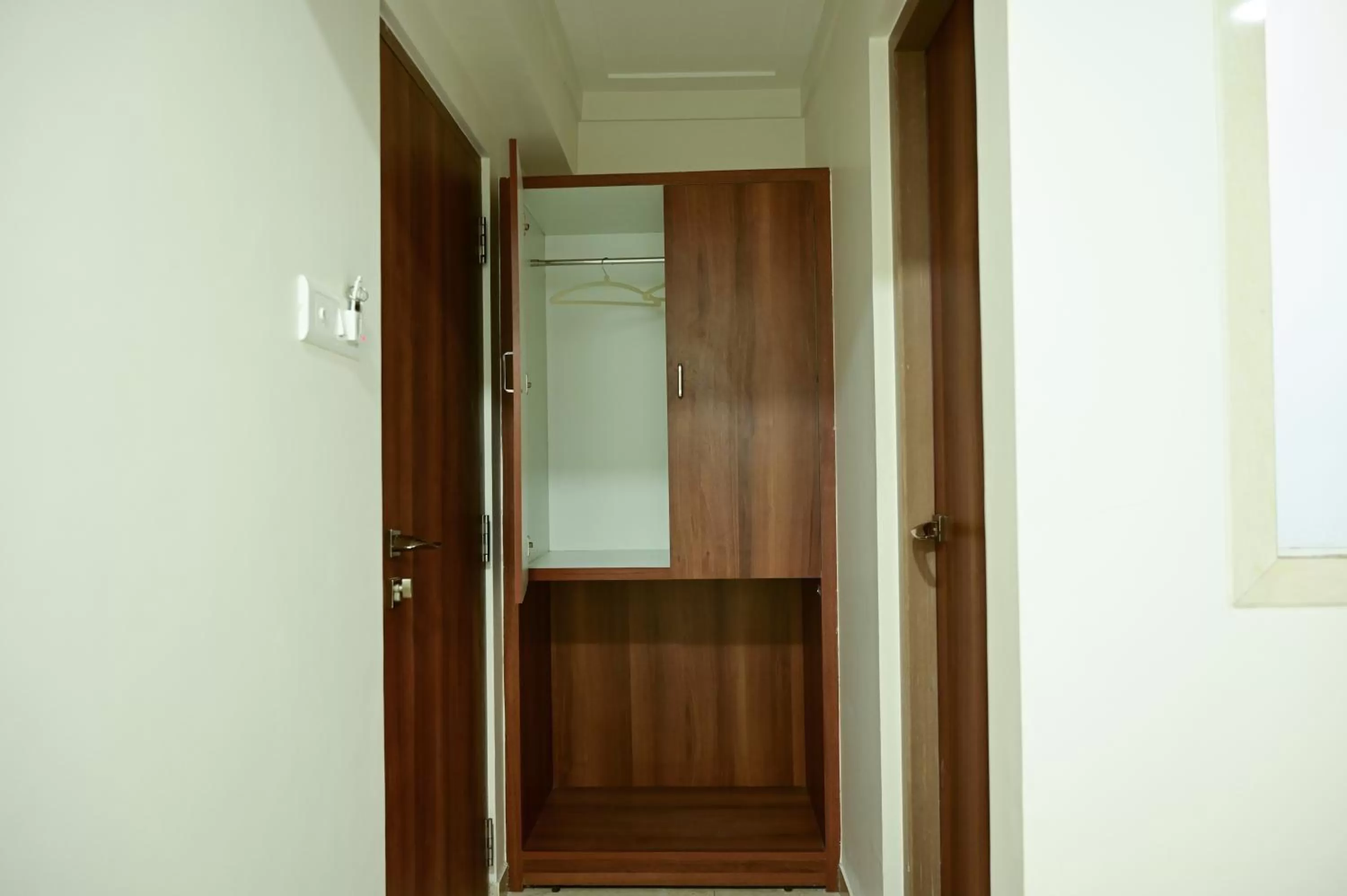 wardrobe, Bathroom in Hotel Diamora Residency