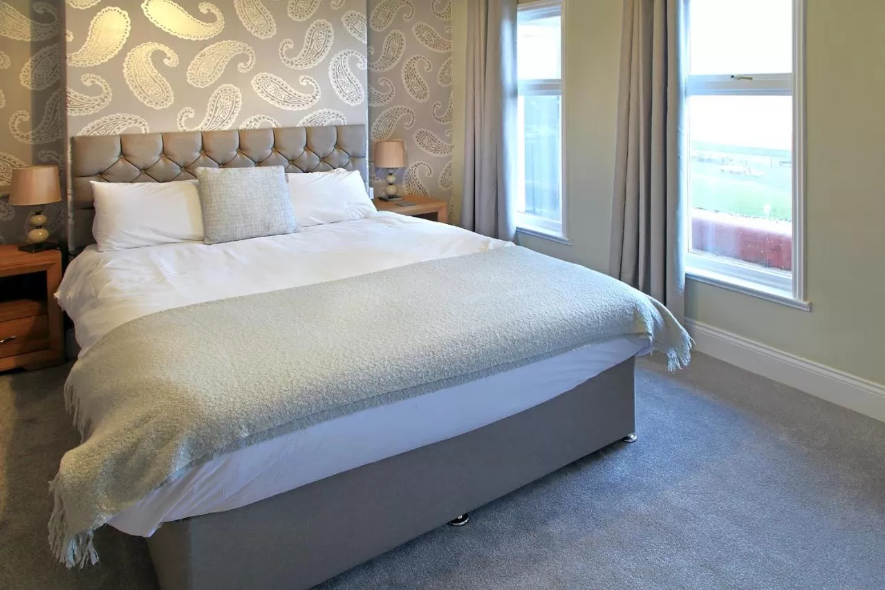 Bed in The Marine Hotel