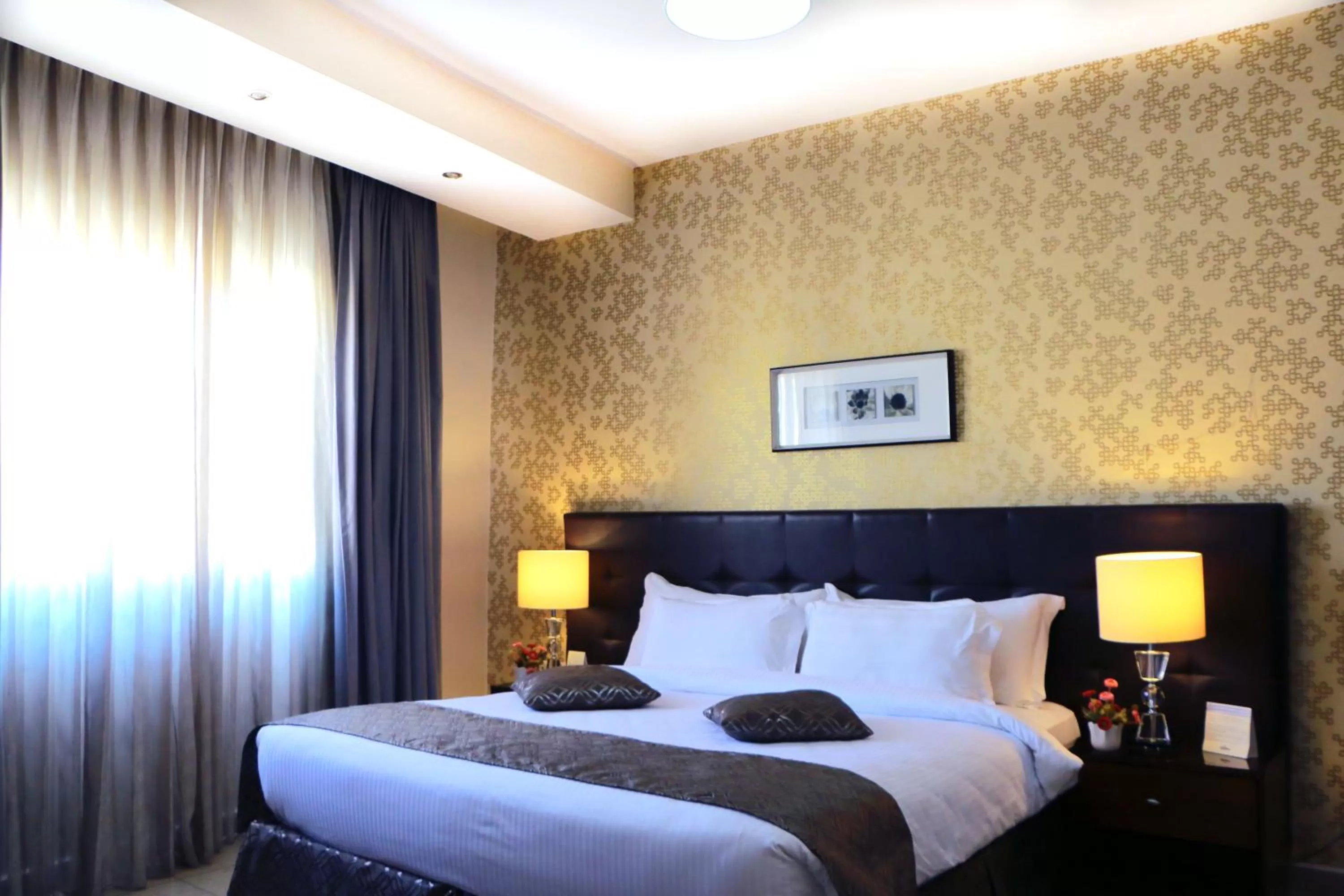 Bed in City Rose Hotel Suites