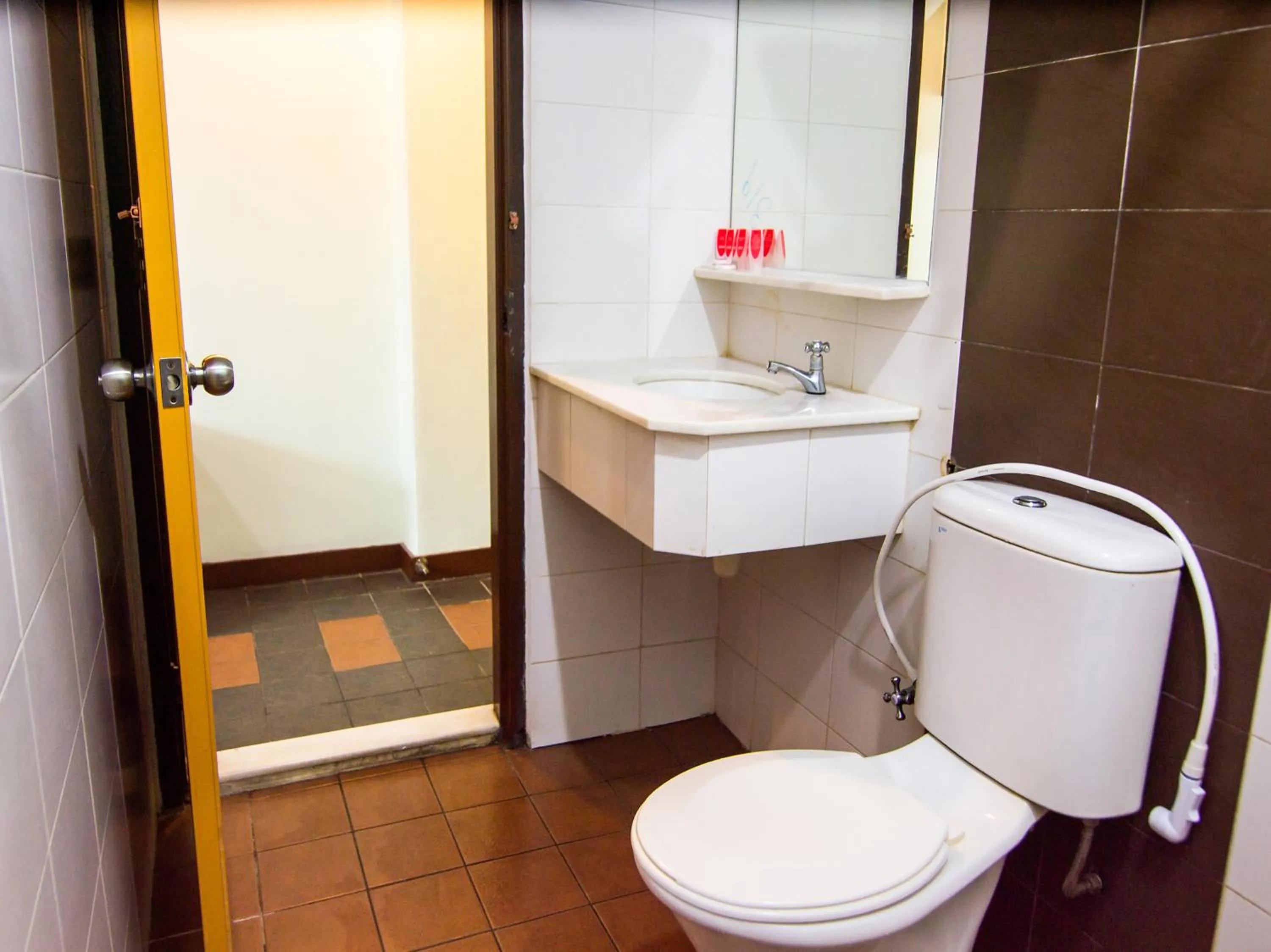 Bathroom in OYO 89408 Royal Hotel