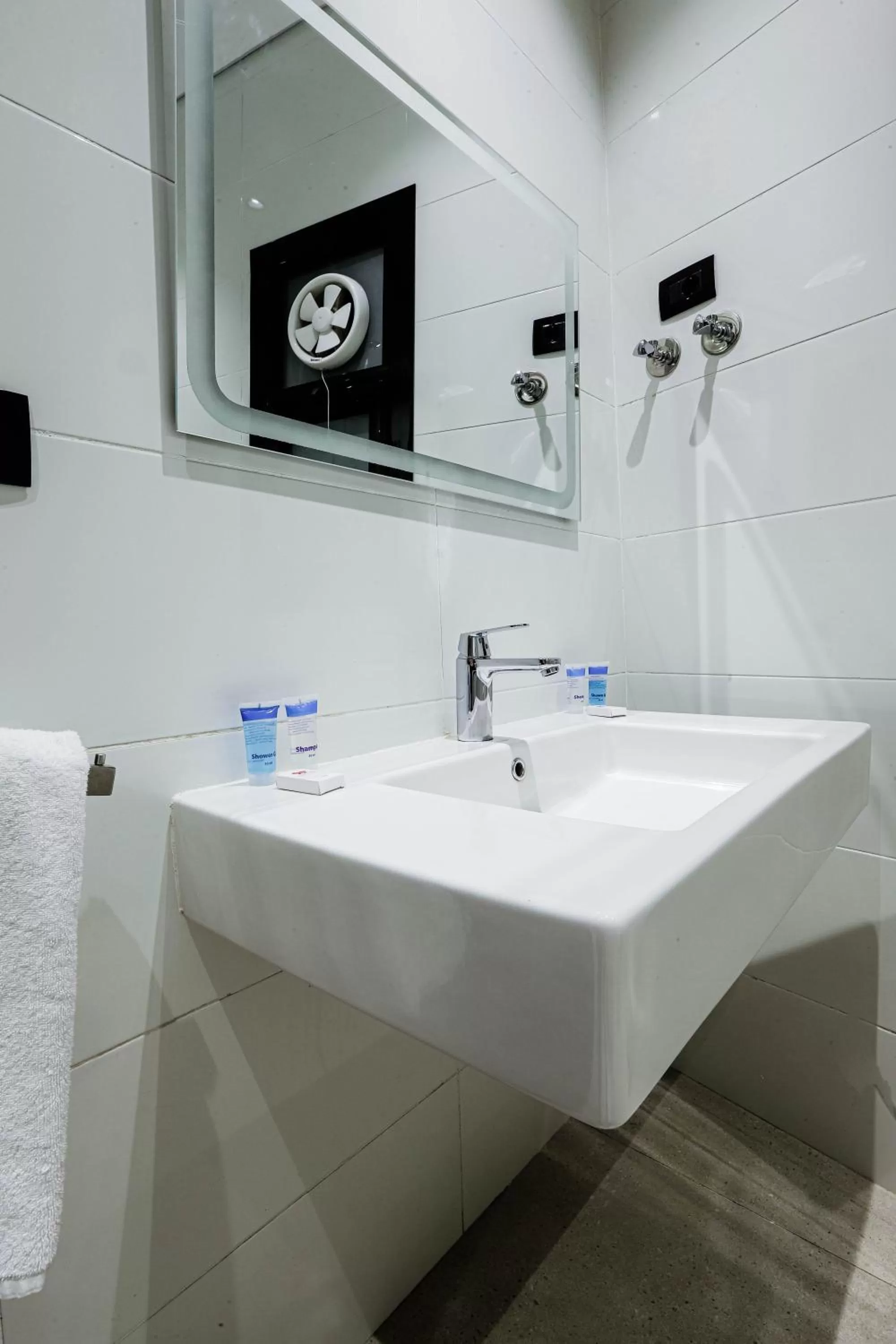 Bathroom in NewCity Hotel & Suites