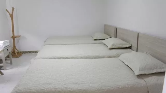 Bed in Hotel Iraka Zenu
