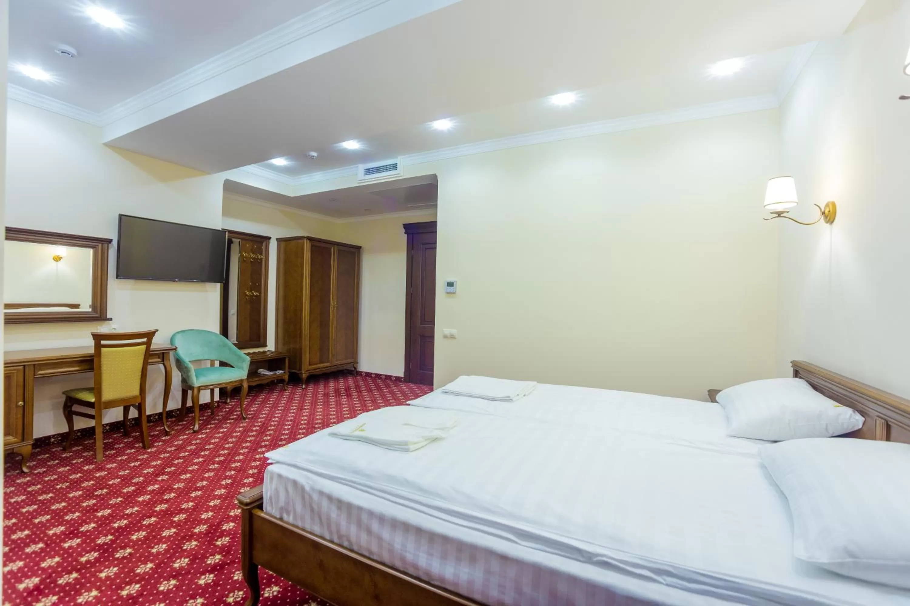 Photo of the whole room, Bed in Ambassador Hotel